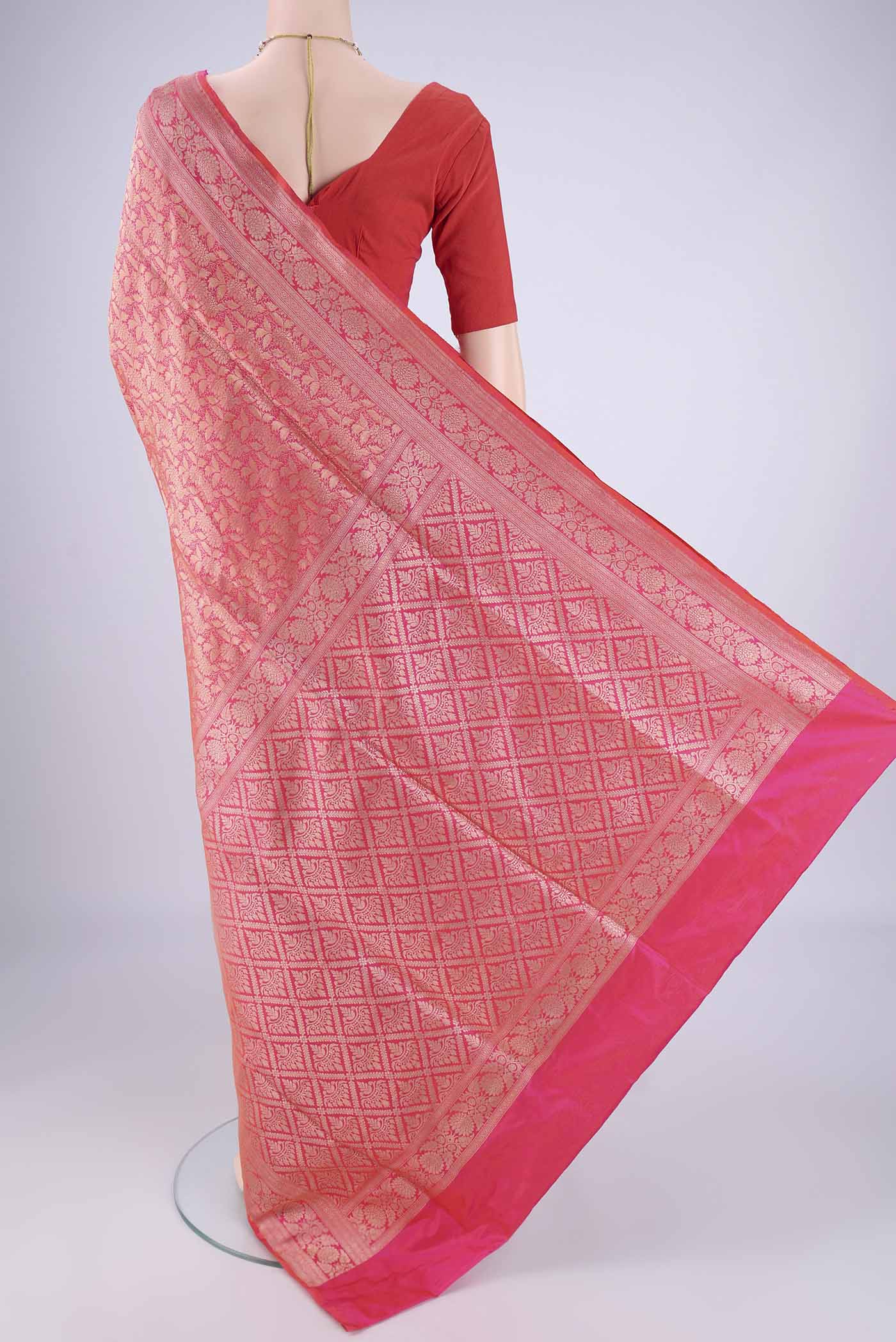 Flat view of Pink Banarasi Silk Saree with Zari Brocade on the body and Zari Border. 