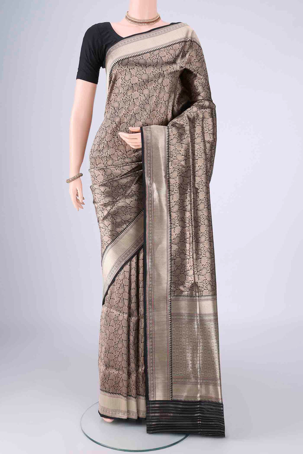 Black Banarasi Silk Saree with Zari Brocade on the body and Zari Border.  displayed on a mannequin