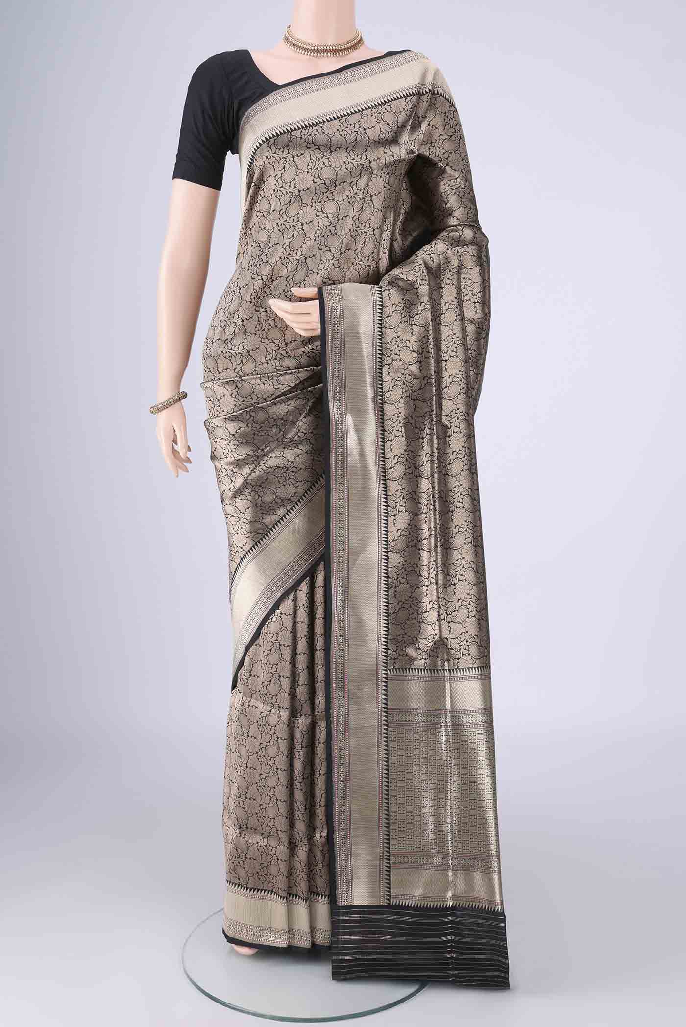 Black Banarasi Silk Saree with Zari Brocade on the body and Zari Border.  displayed on a mannequin