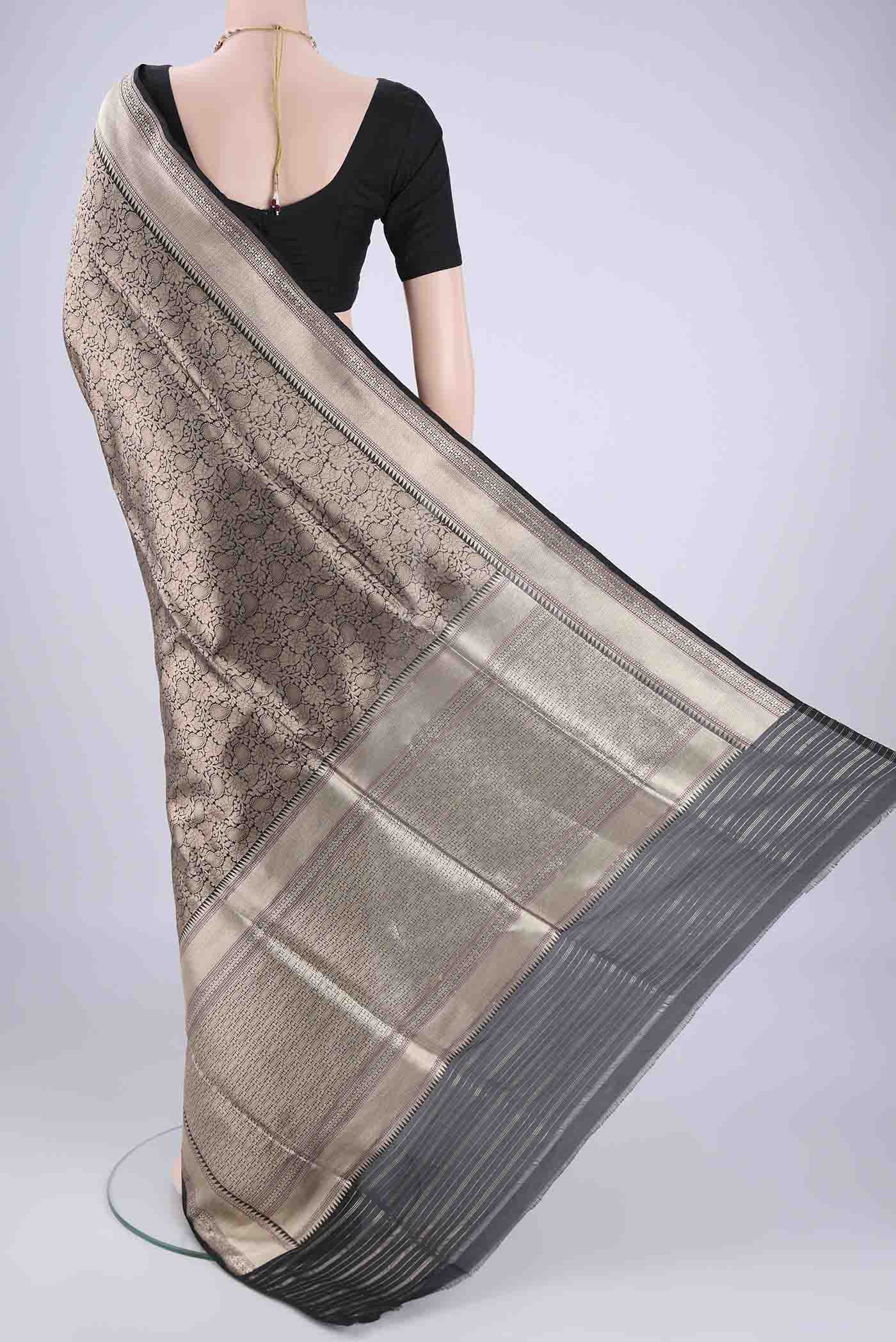 Flat view of Black Banarasi Silk Saree with Zari Brocade on the body and Zari Border. 