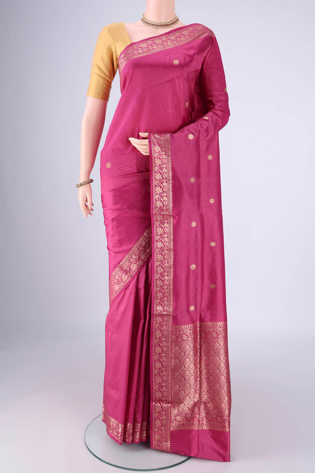 Pink Banarasi Katan Silk Saree with Zari Butta on the body and Zari Border.  displayed on a mannequin