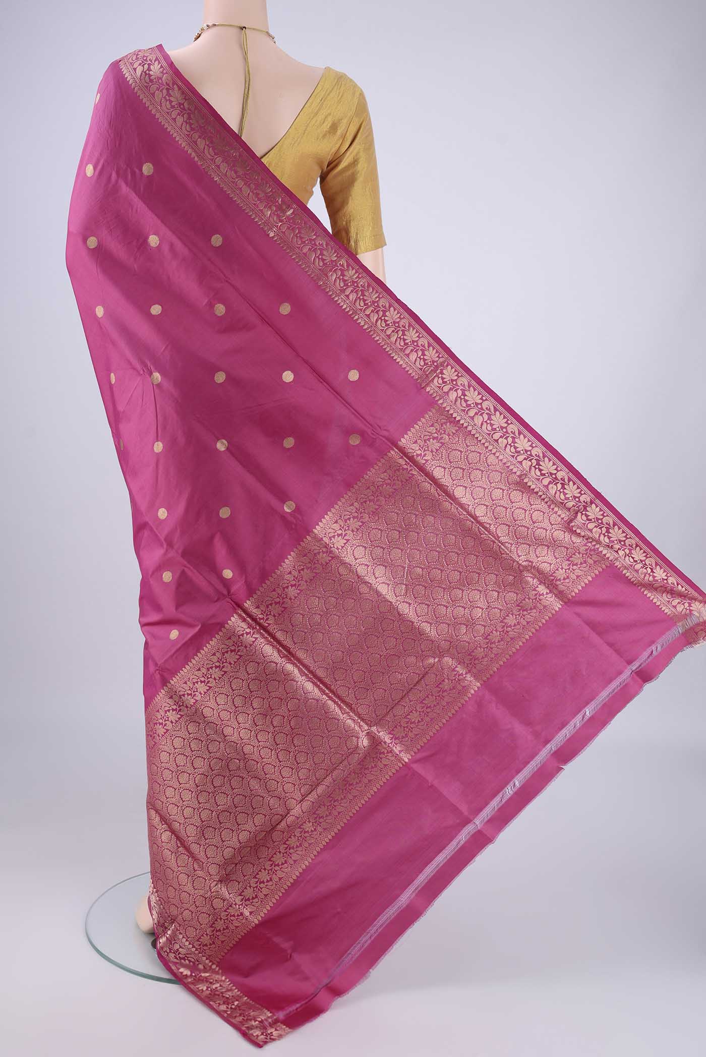Flat view of Pink Banarasi Katan Silk Saree with Zari Butta on the body and Zari Border. 