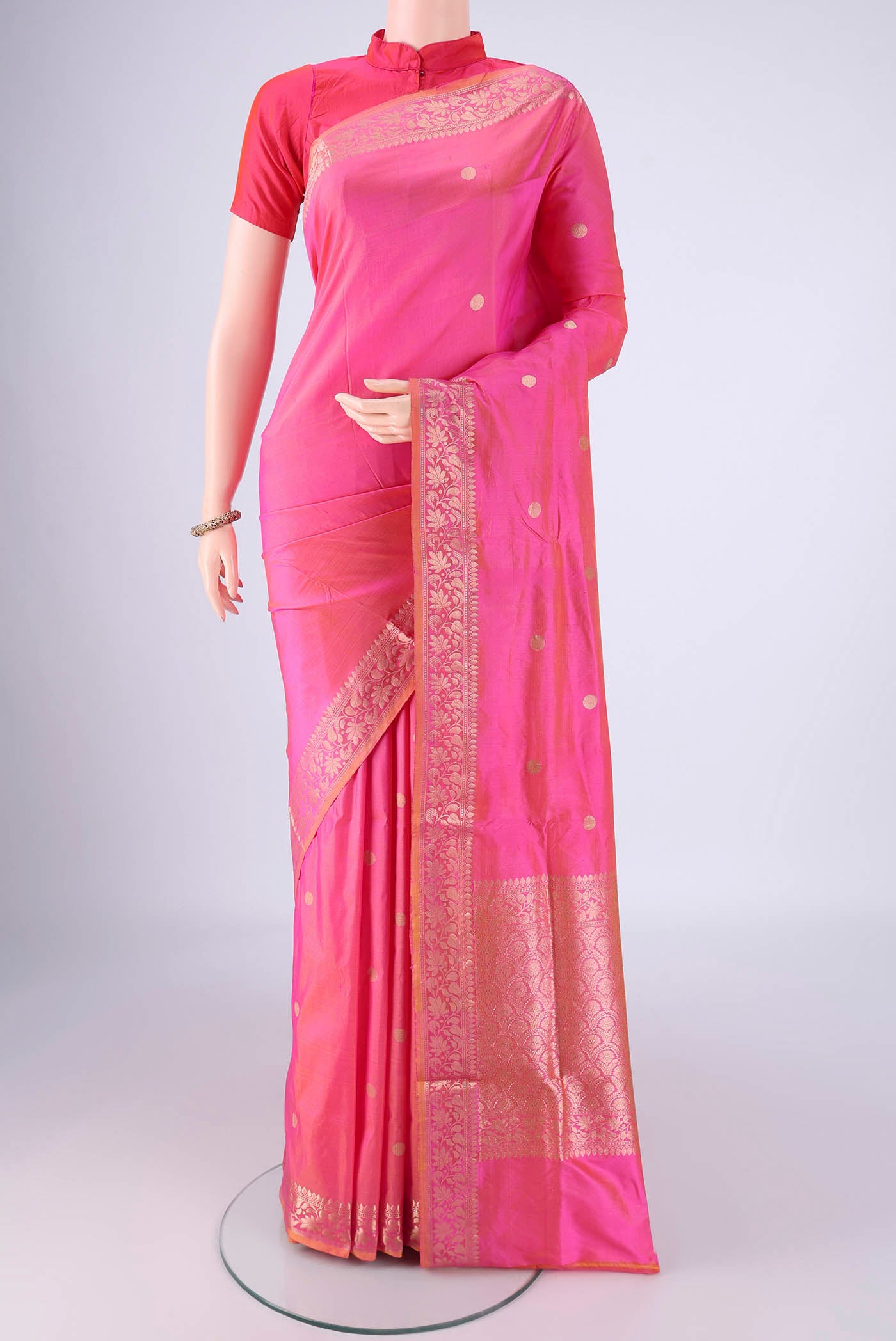 Pink Banarasi Katan Silk Saree with Zari Butta on the body and Zari Border.  displayed on a mannequin