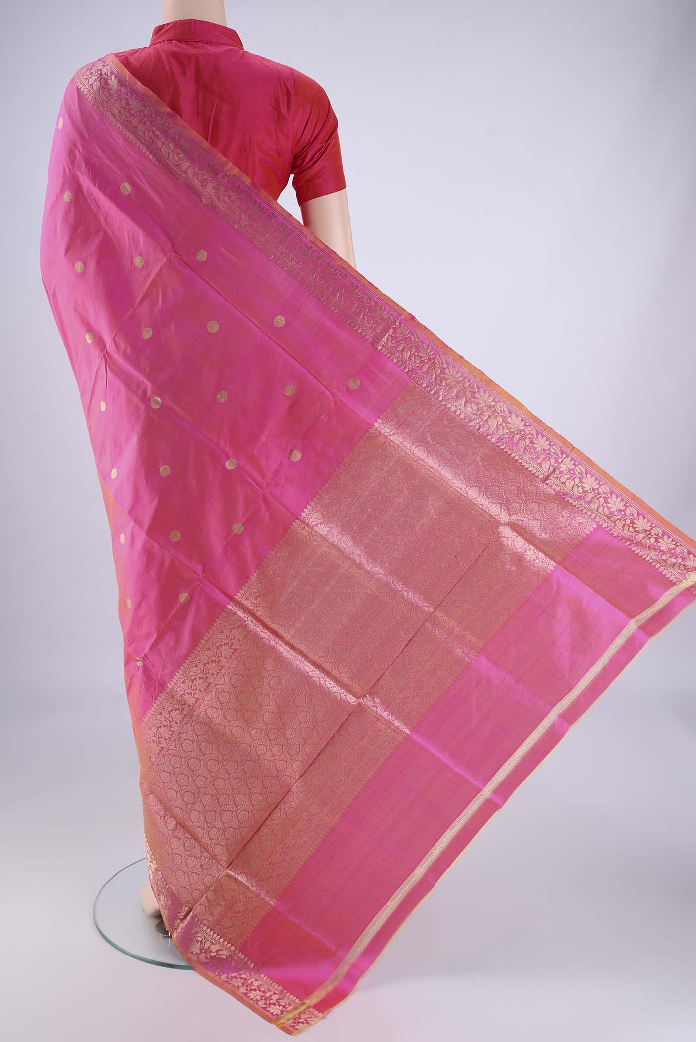 Flat view of Pink Banarasi Katan Silk Saree with Zari Butta on the body and Zari Border. 