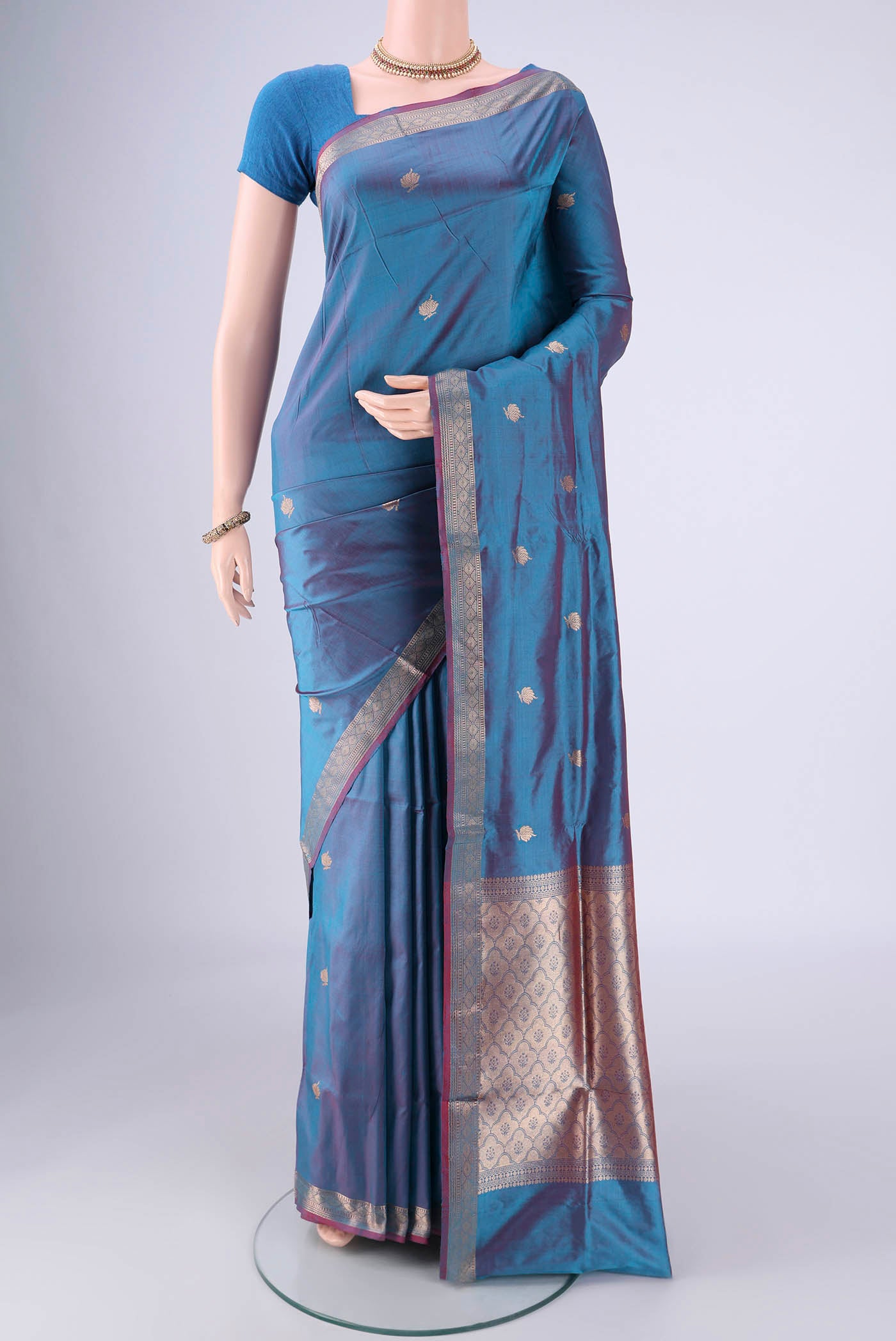 Blue Dual Tone Banarasi Katan Silk Saree with Zari Butta on the body and Zari Border.  displayed on a mannequin