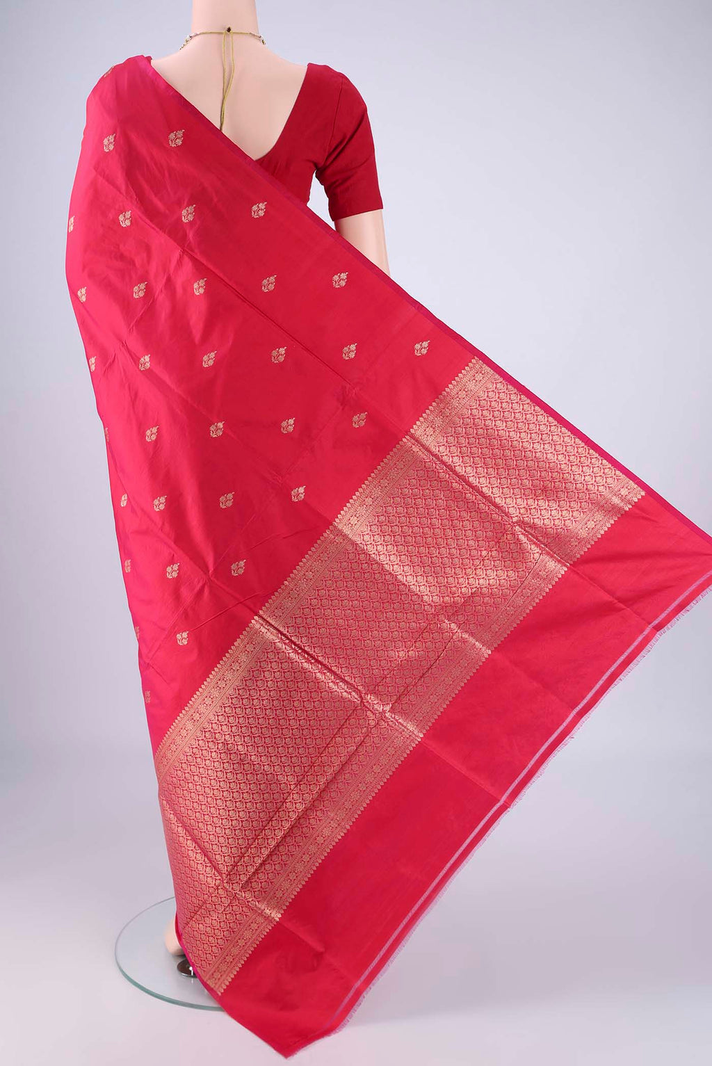 Flat view of Dark Pink Banarasi Silk Saree with Zari Butta on the body and Without Border. 