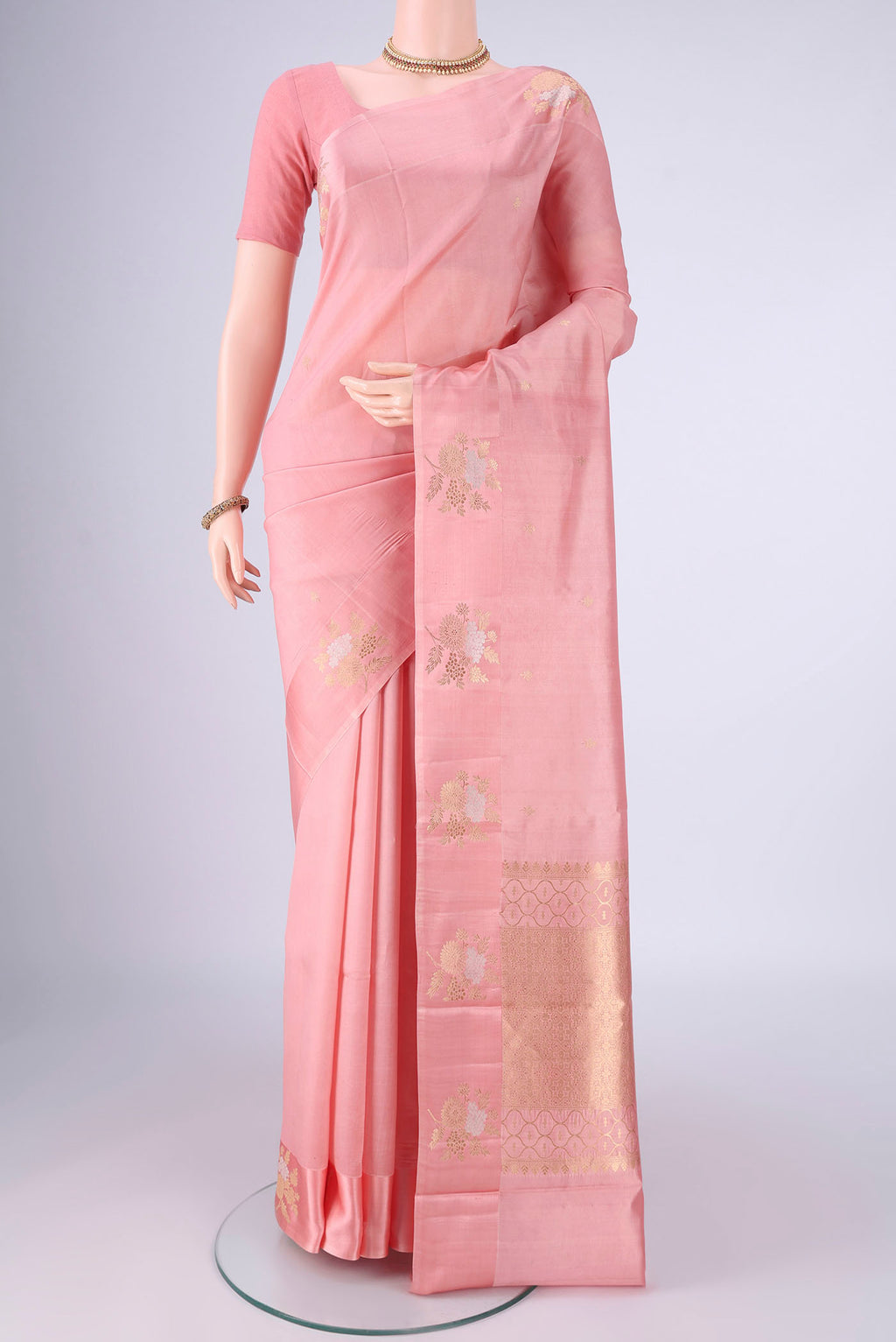 Rose pink Banarasi Silk Saree with Zari Butta on the body and Satin Border.  displayed on a mannequin