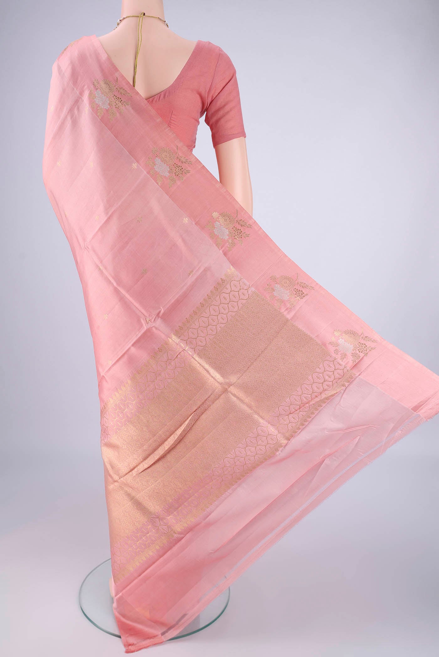 Flat view of Rose pink Banarasi Silk Saree with Zari Butta on the body and Satin Border. 