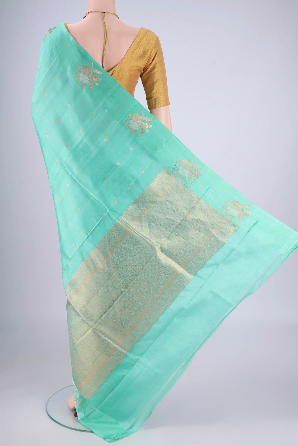 Flat view of Turquoise Banarasi Katan Silk Saree with Stripes on the body and Zari Border. 