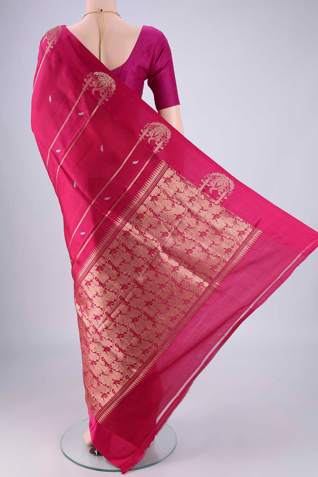 Flat view of Rani Pink Banarasi Katan Silk Saree with Zari Butta on the body and Satin Border. 