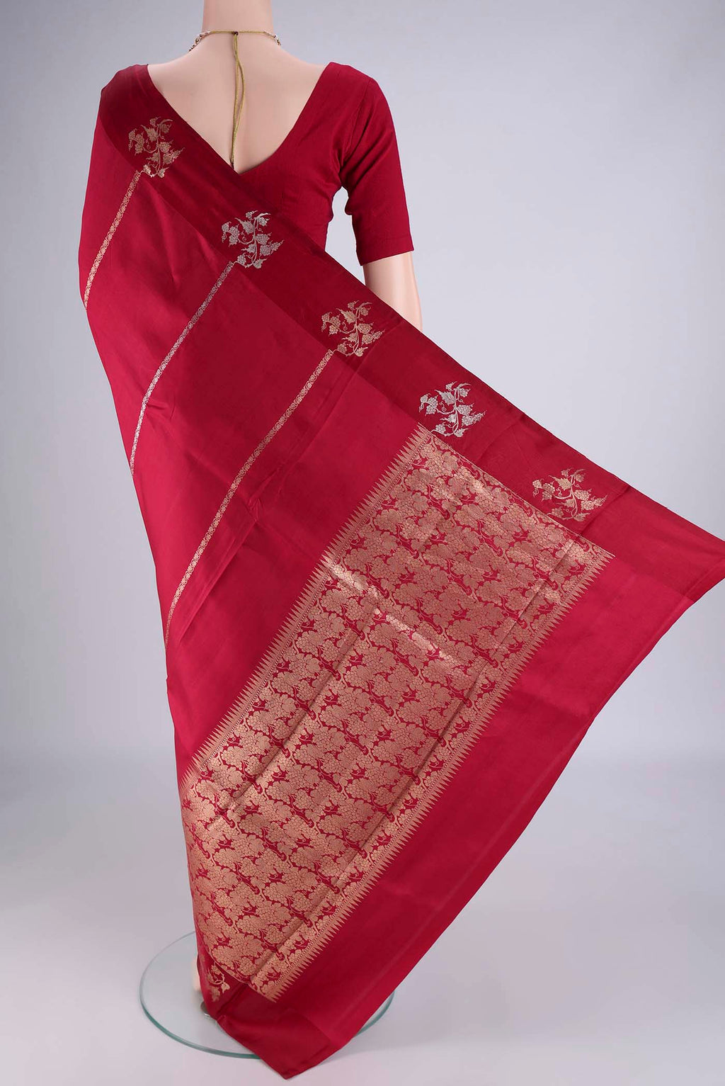 Flat view of Maroon Banarasi Katan Silk Saree with Stripes on the body and Zari Border. 