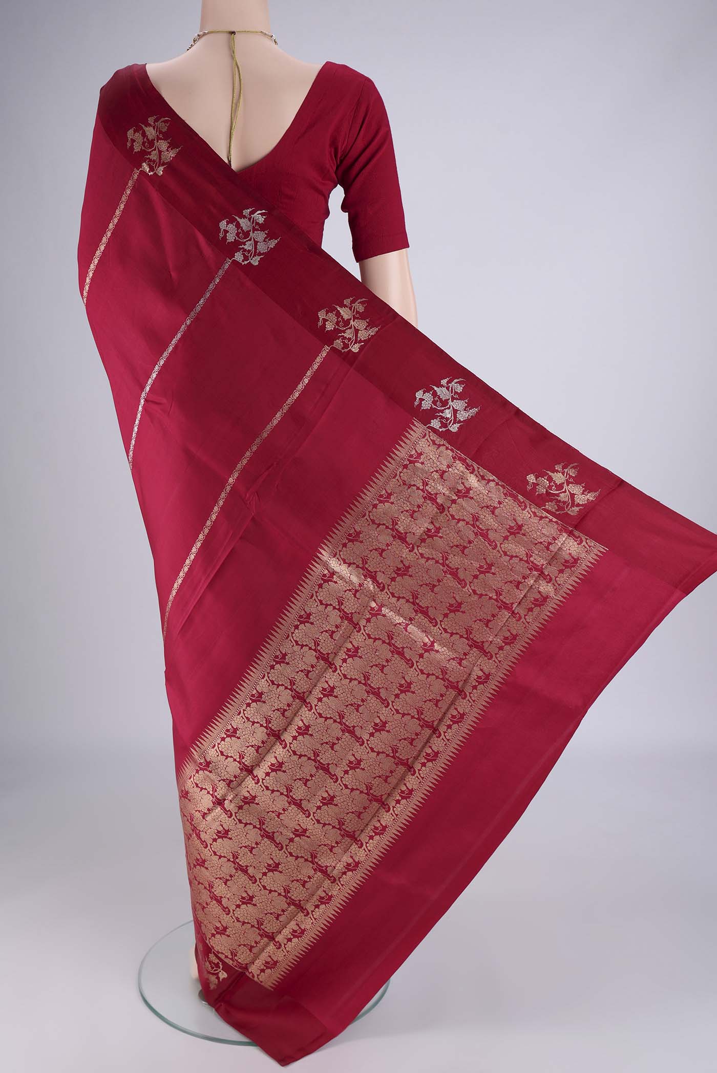Flat view of Maroon Banarasi Katan Silk Saree with Stripes on the body and Zari Border. 