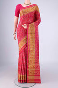 Dark Pink Rajkot Patola Silk Saree with Pure Ikat on the body and Ikat Border.  displayed on a mannequin