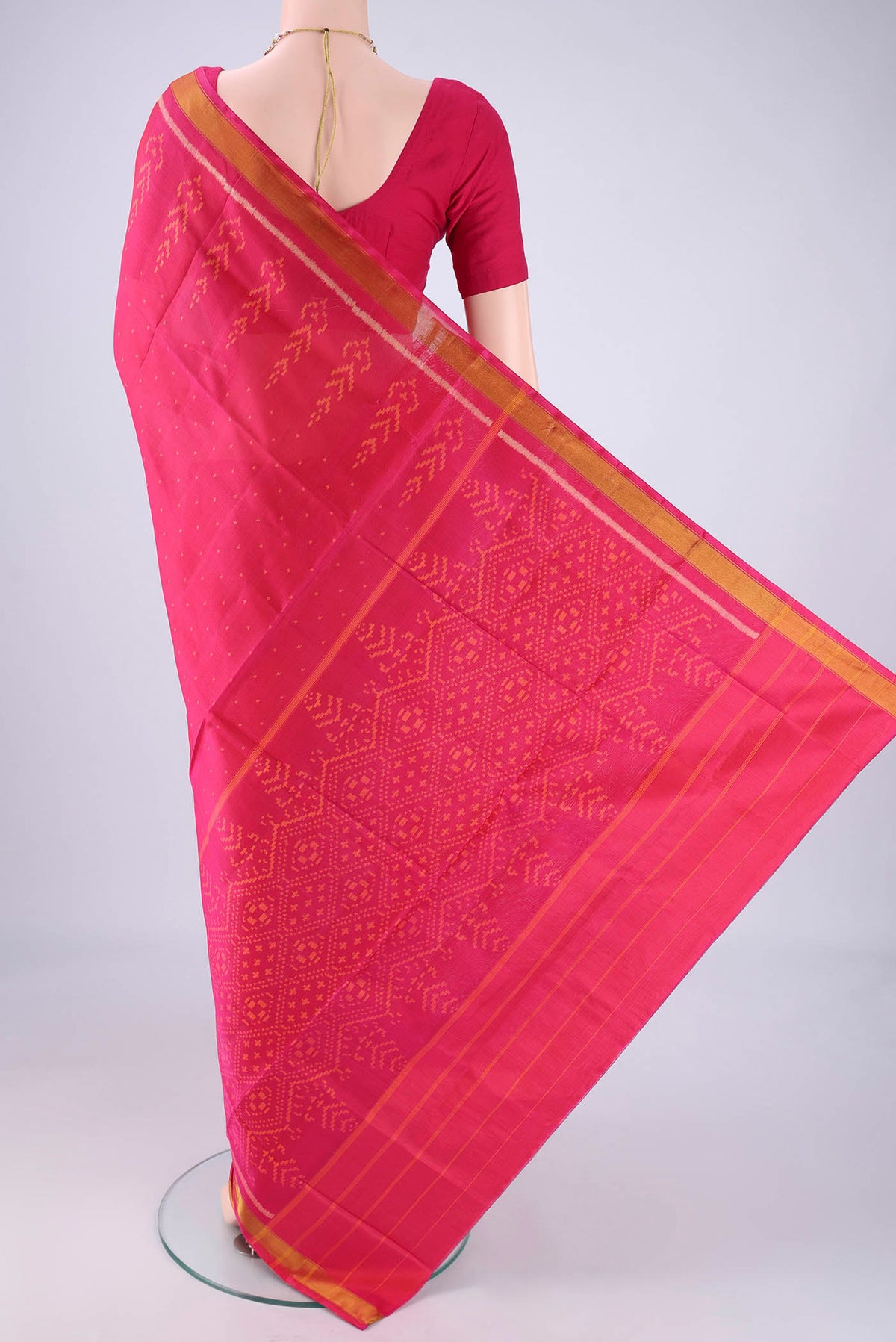 Flat view of Dark Pink Rajkot Patola Silk Saree with Pure Ikat on the body and Ikat Border. 