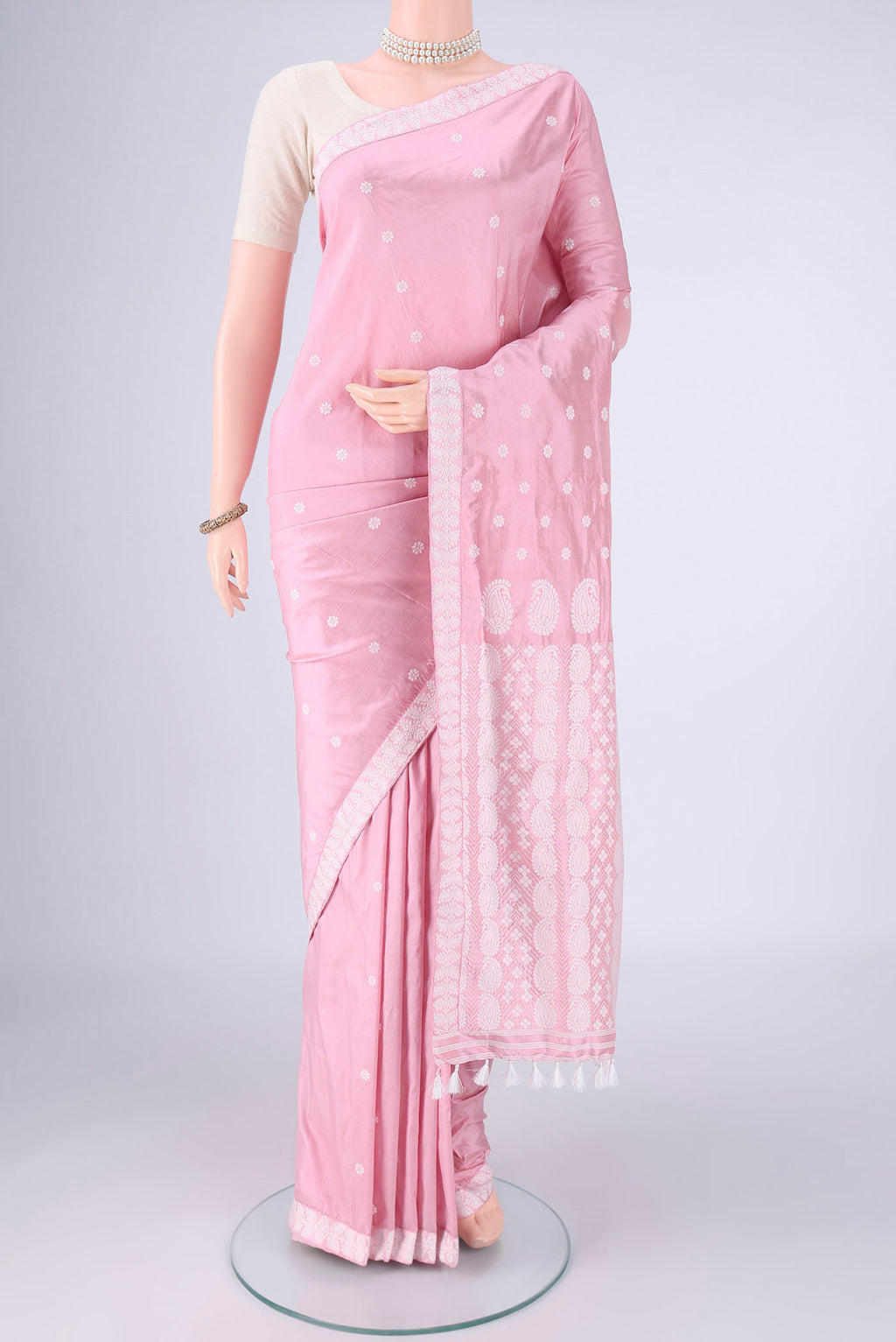 Rose pink Assam Silk Saree with Thread Butta on the body and Thread Border.  displayed on a mannequin