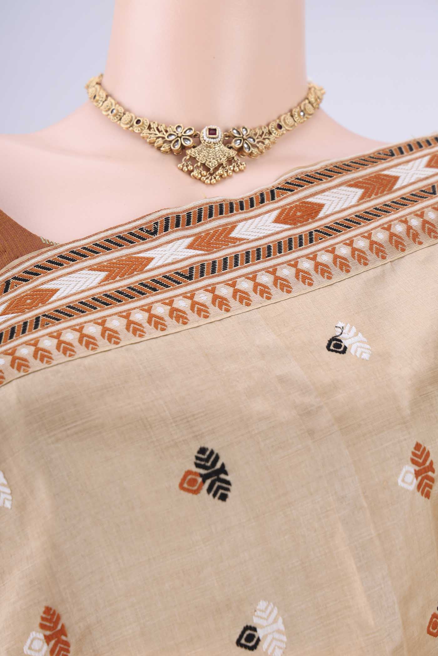 Border image of Beige Assam Silk Saree with Thread Butta on the body and Thread Border. 