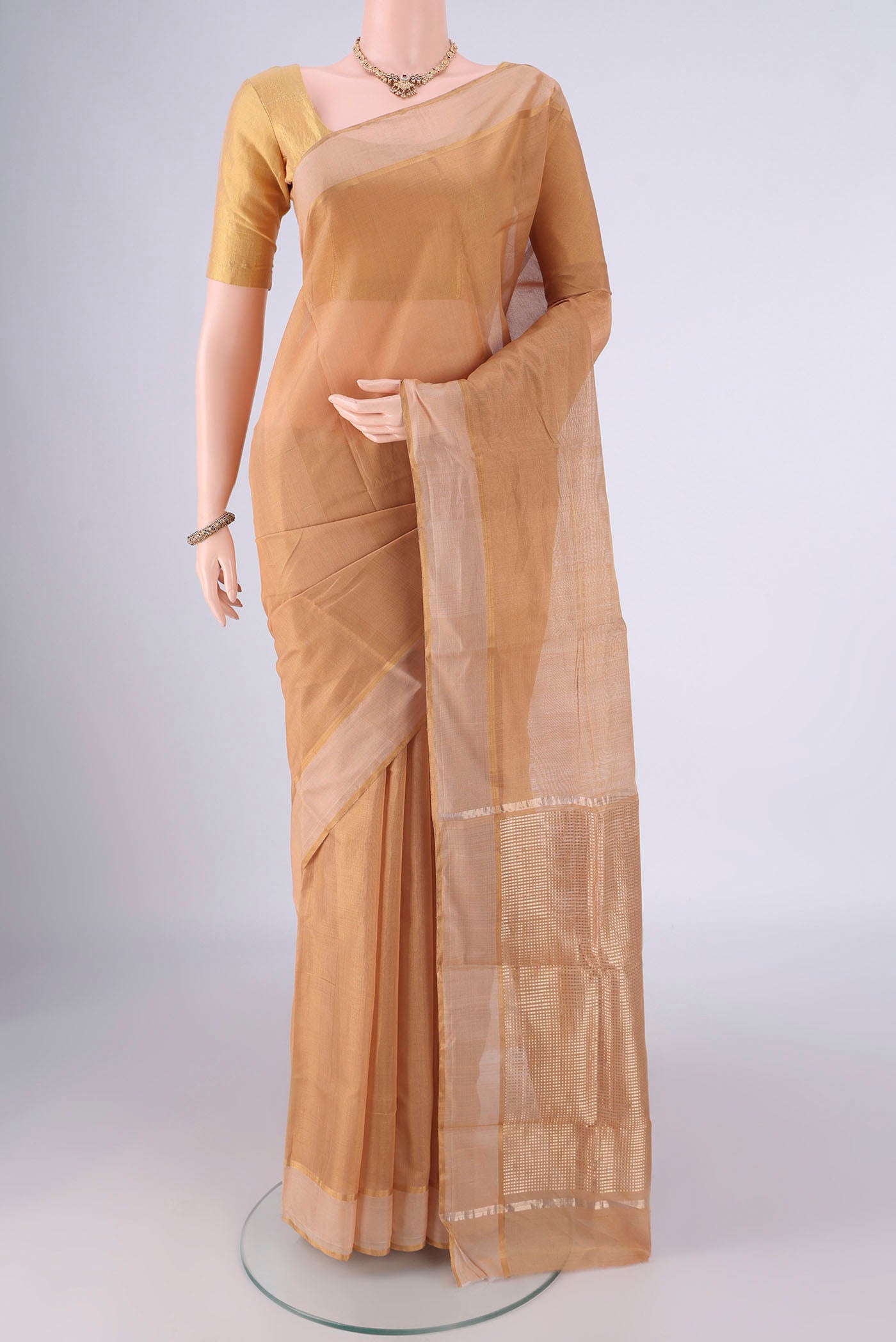Dark Beige Chanderi Silk Cotton Saree with Plain Body and Zari Border.  displayed on a mannequin