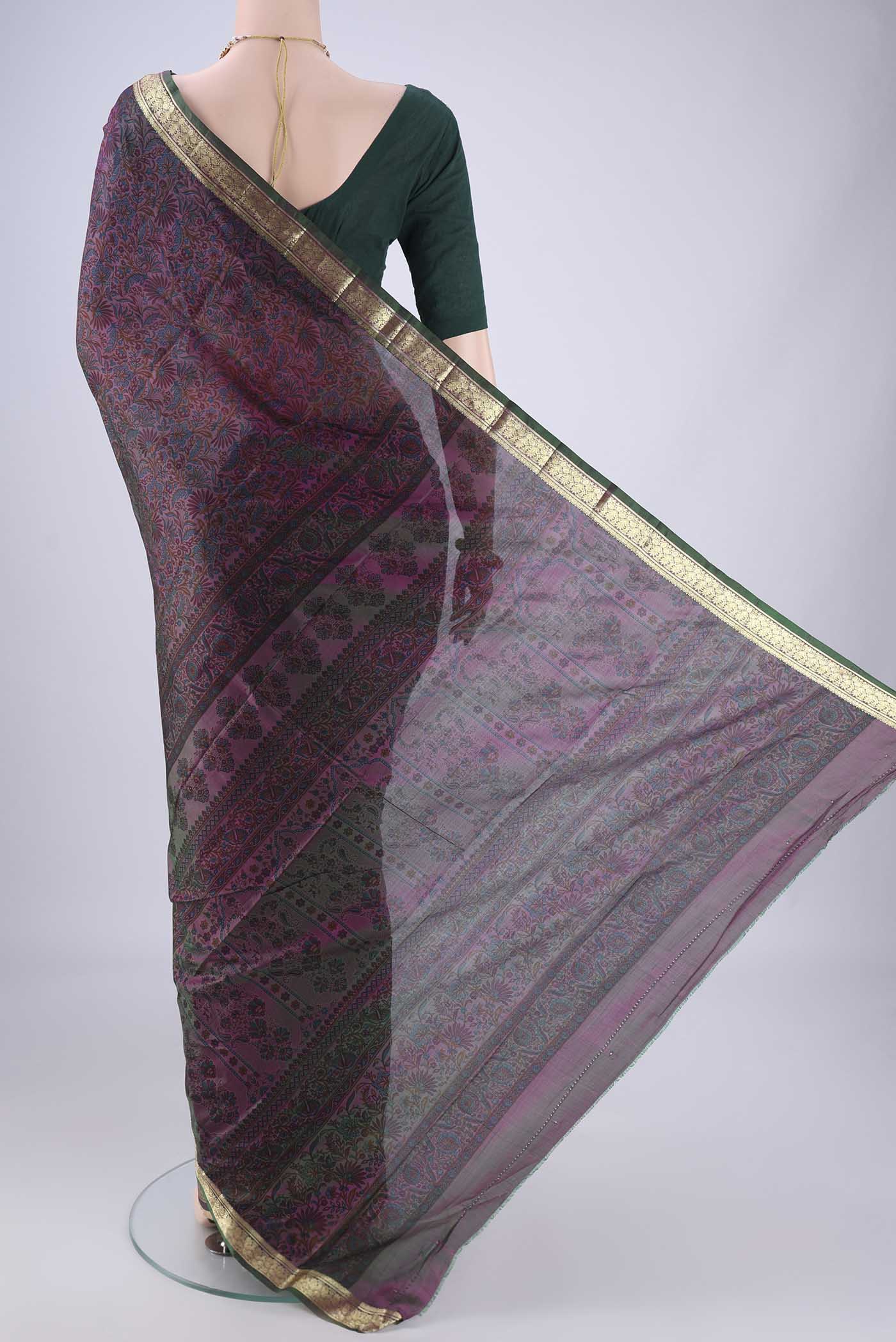 Flat view of Purple Printed Silk Saree with Printed design on the body and Zari Border. 