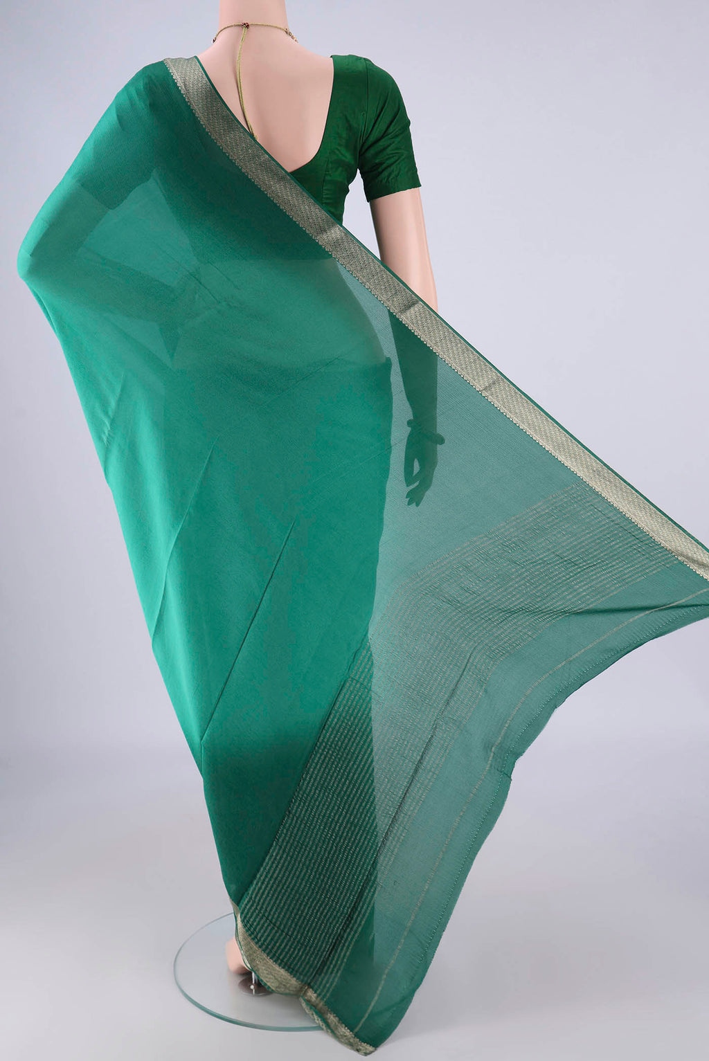 Flat view of Sea Green Dual Tone Mysore Chiffon Saree with Plain Body and Zari Border. 