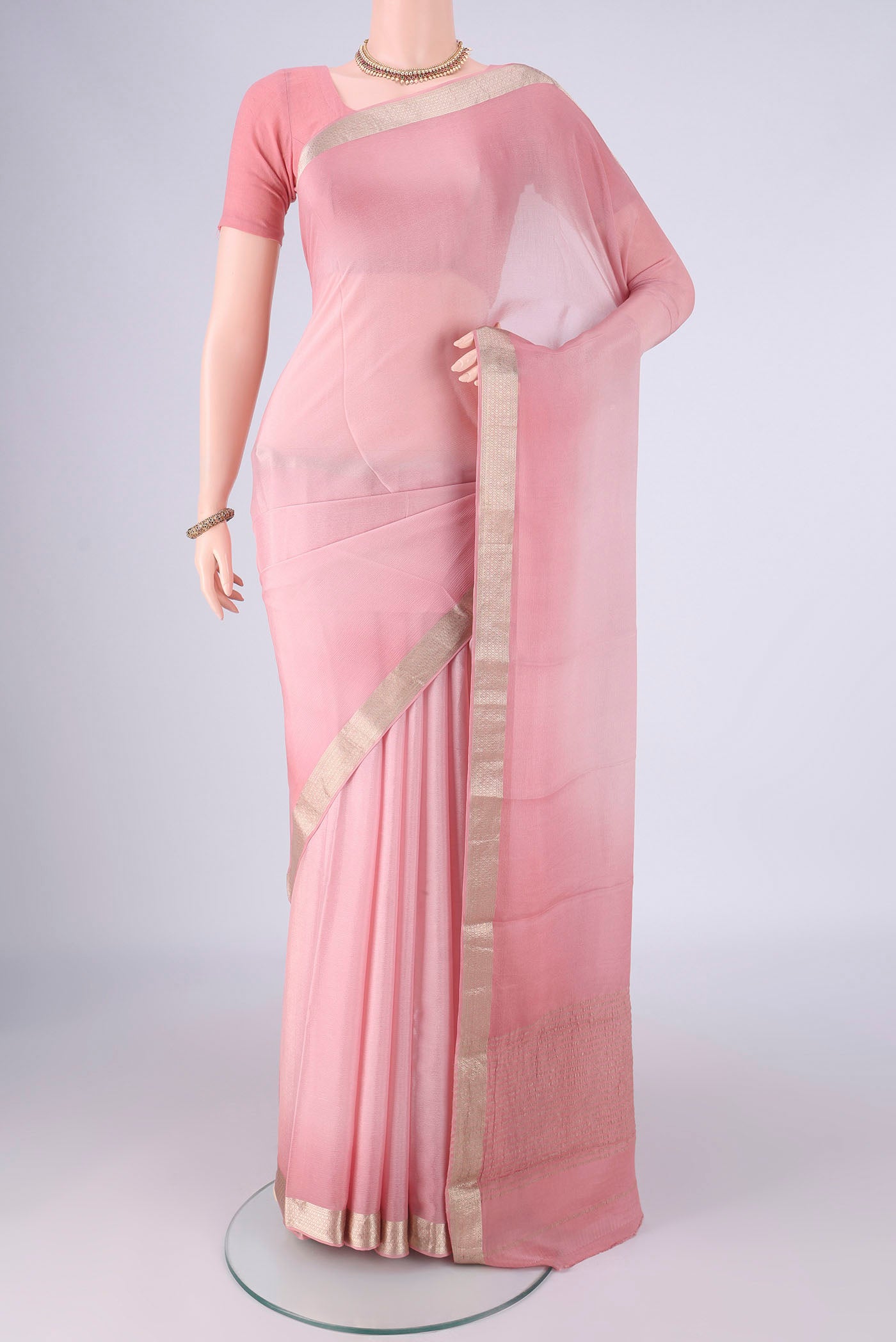 Rose pink Mysore Chiffon Saree with Plain Body and Zari Border.  displayed on a mannequin