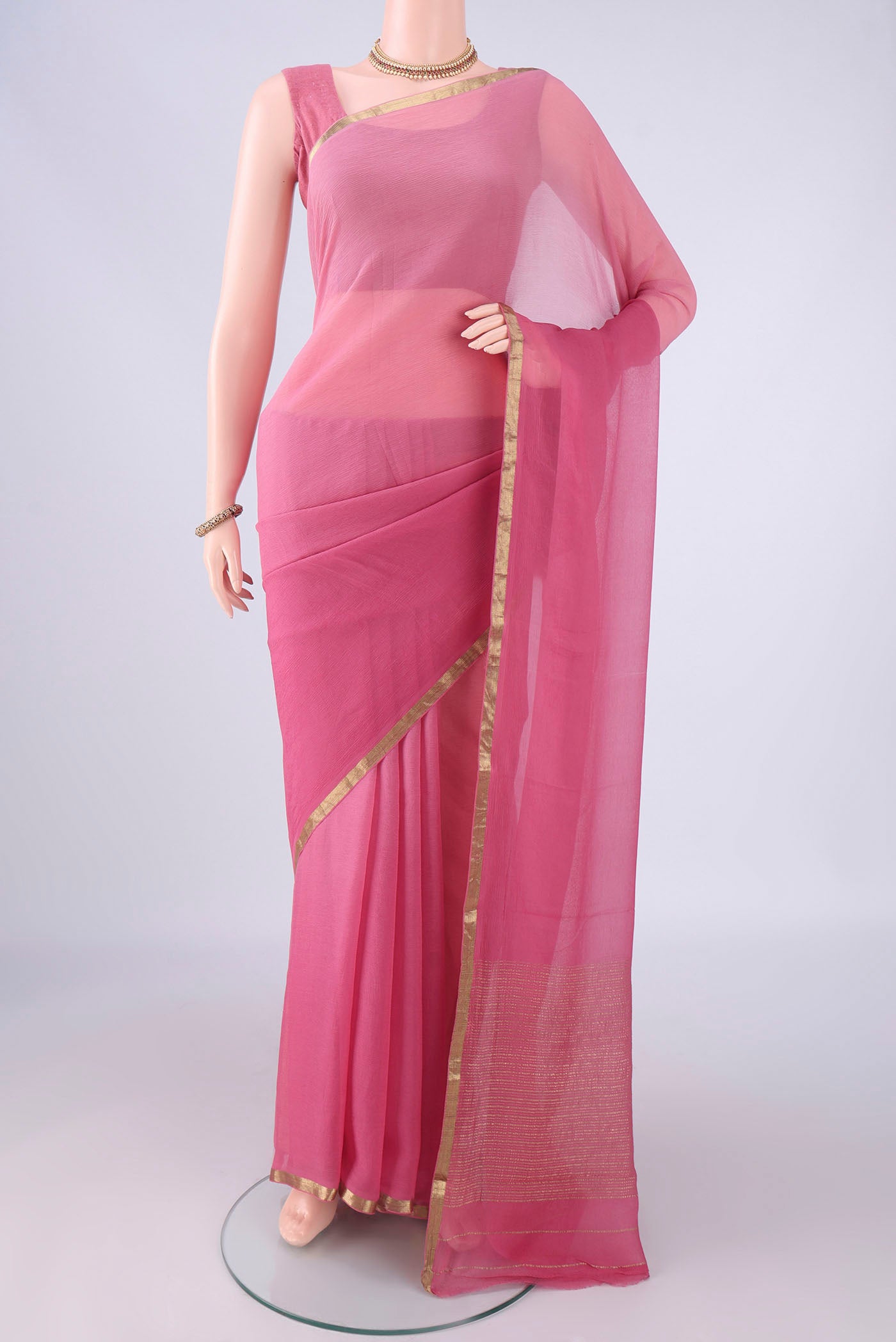 Pink Mysore Chiffon Saree with Plain Body and Zari Border.  displayed on a mannequin