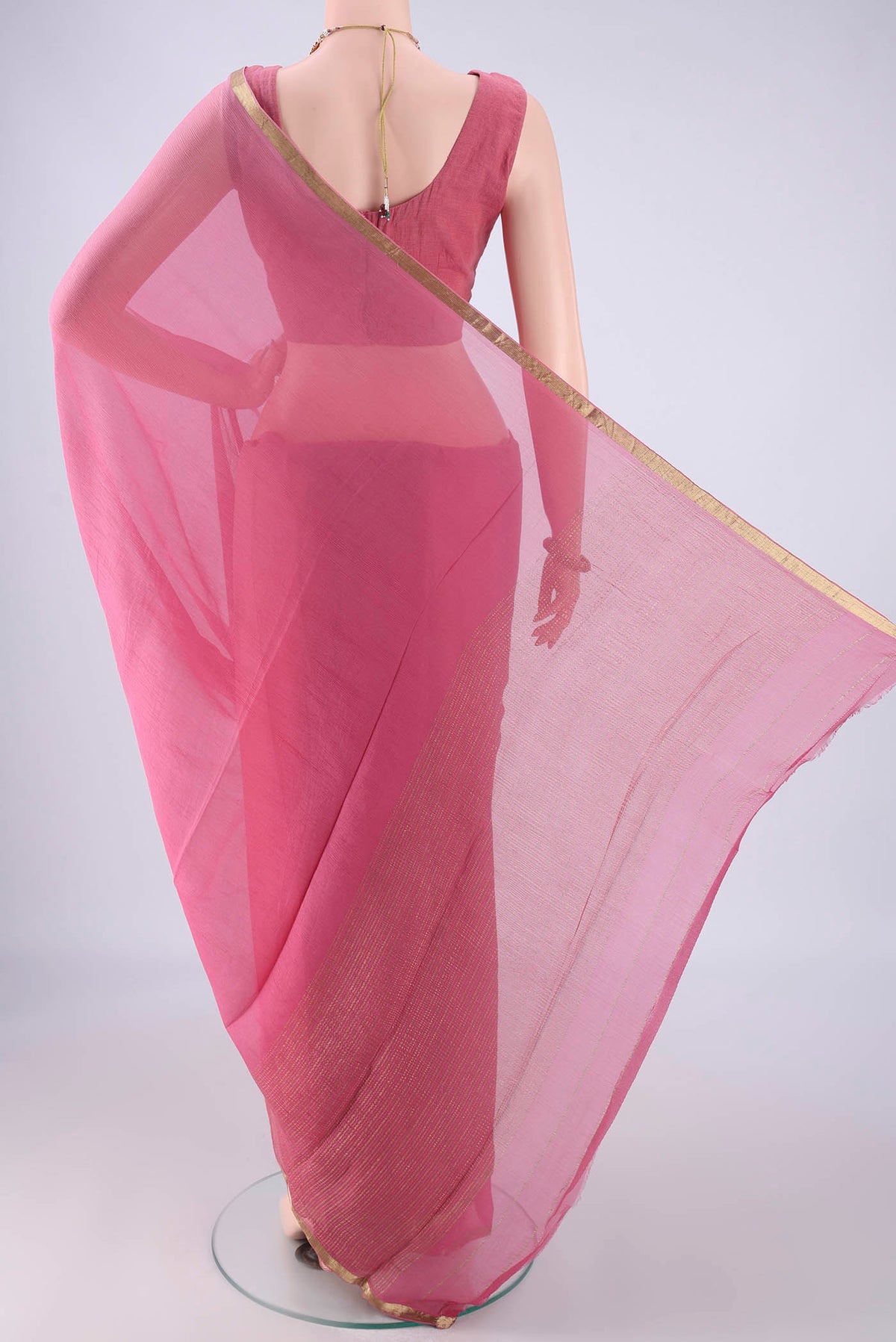 Flat view of Pink Mysore Chiffon Saree with Plain Body and Zari Border. 