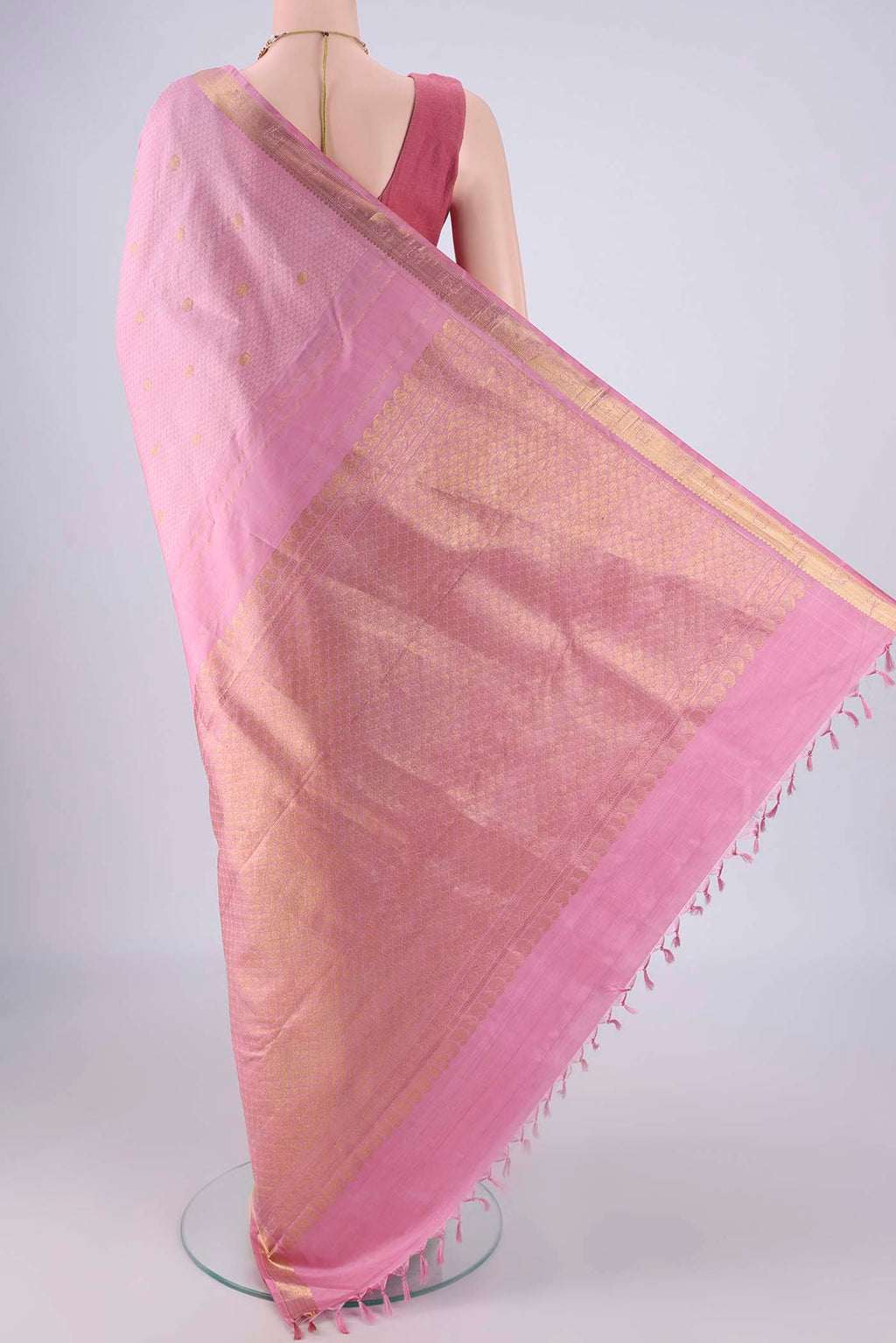 Flat view of Rose pink Kanjivaram Silk Saree with Jacquard With Zari Butta on the body and Zari Border. 