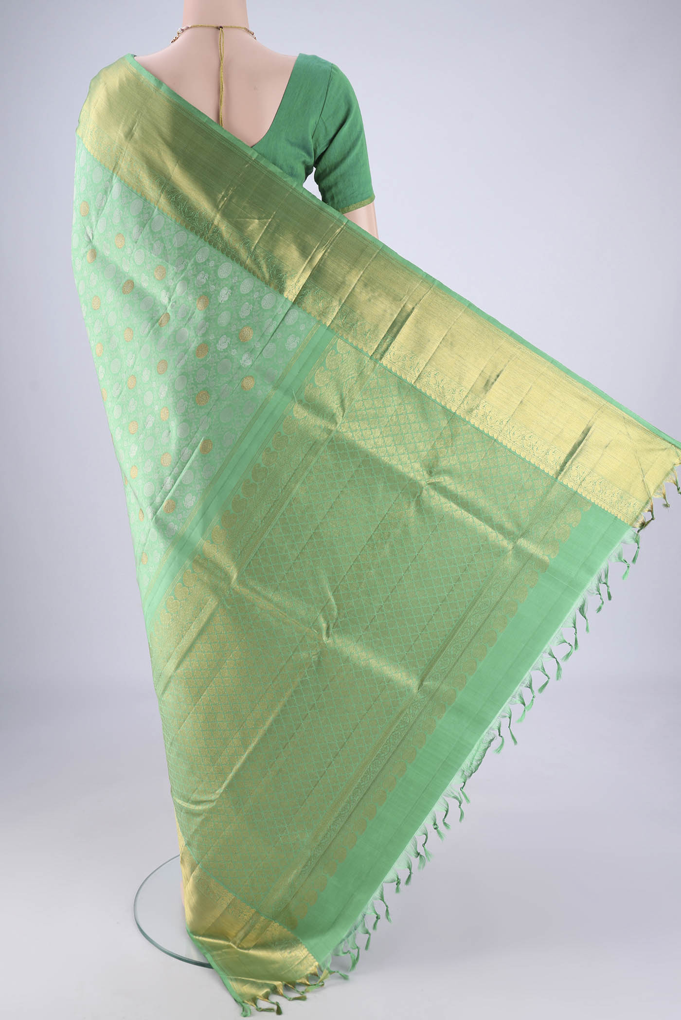 Flat view of Sea Green Kanjivaram Silk Saree with Jacquard With Zari Butta on the body and Zari Border. 