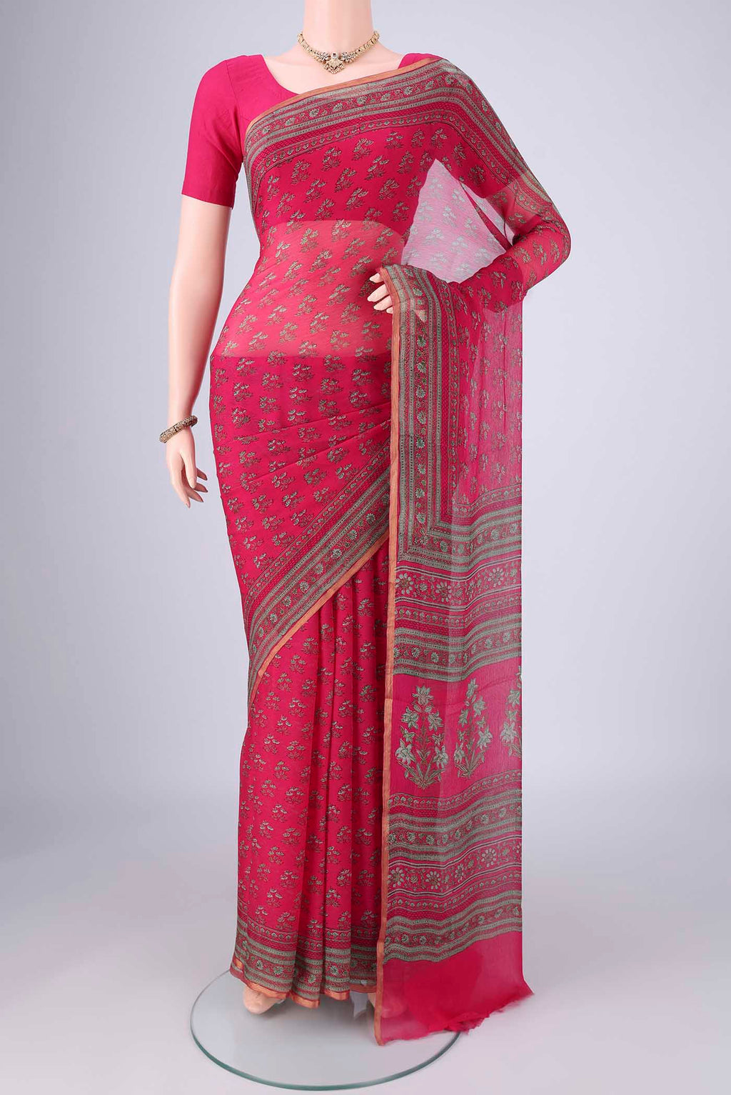 Rani Pink Mysore Chiffon Saree with Floral Print on the body and Printed Border.  displayed on a mannequin