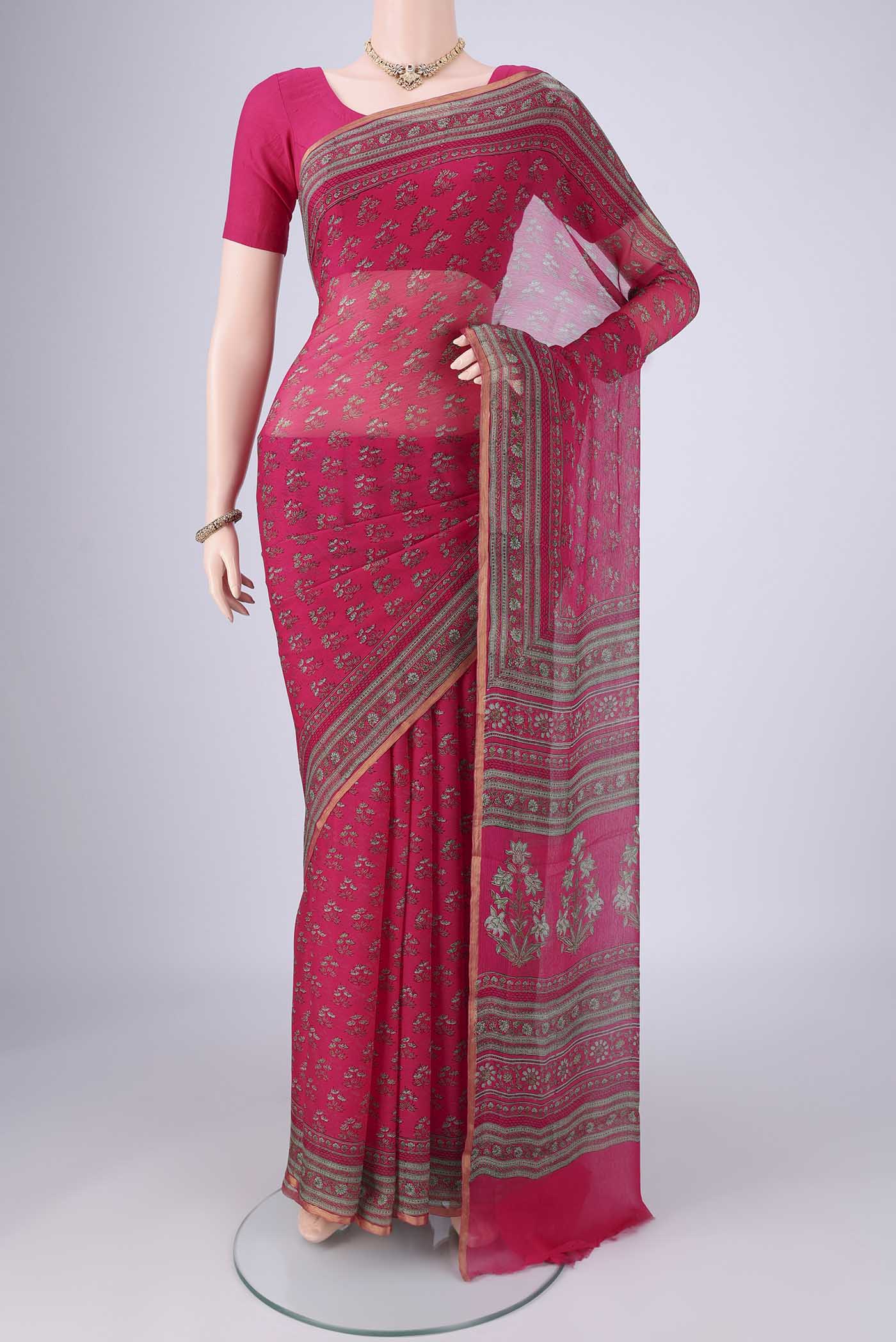 Rani Pink Mysore Chiffon Saree with Floral Print on the body and Printed Border.  displayed on a mannequin