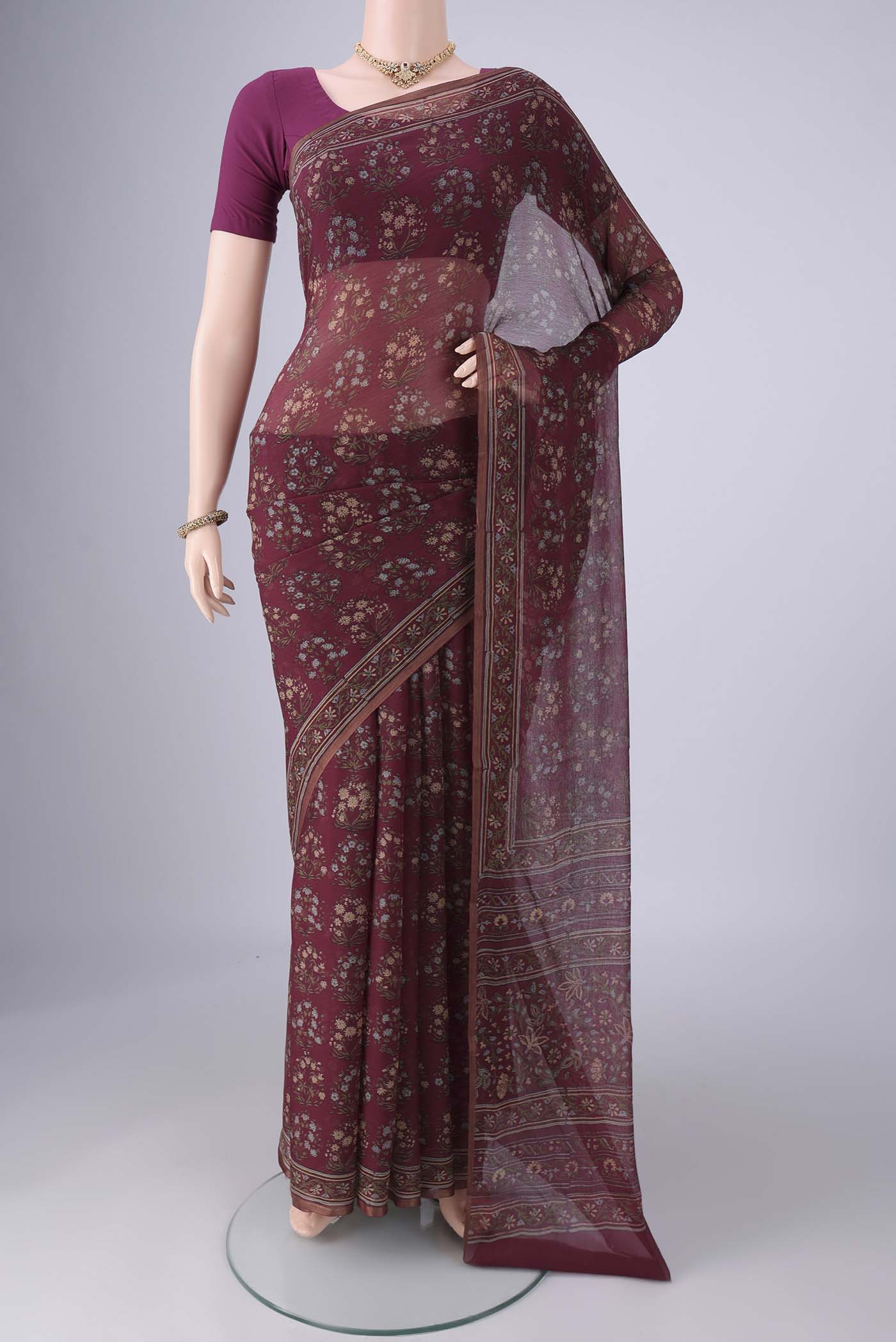 Purple Mysore Chiffon Saree with Floral Print on the body and Thin Zari Line.  displayed on a mannequin