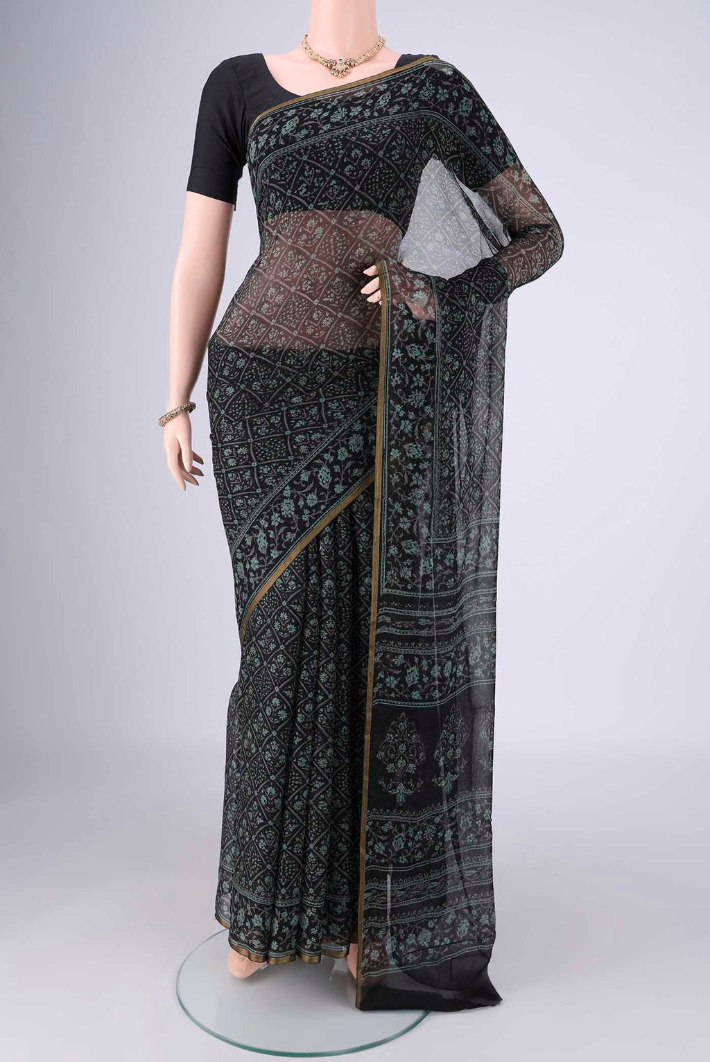 Black Mysore Chiffon Saree with Floral Print on the body and Thin Zari Line.  displayed on a mannequin