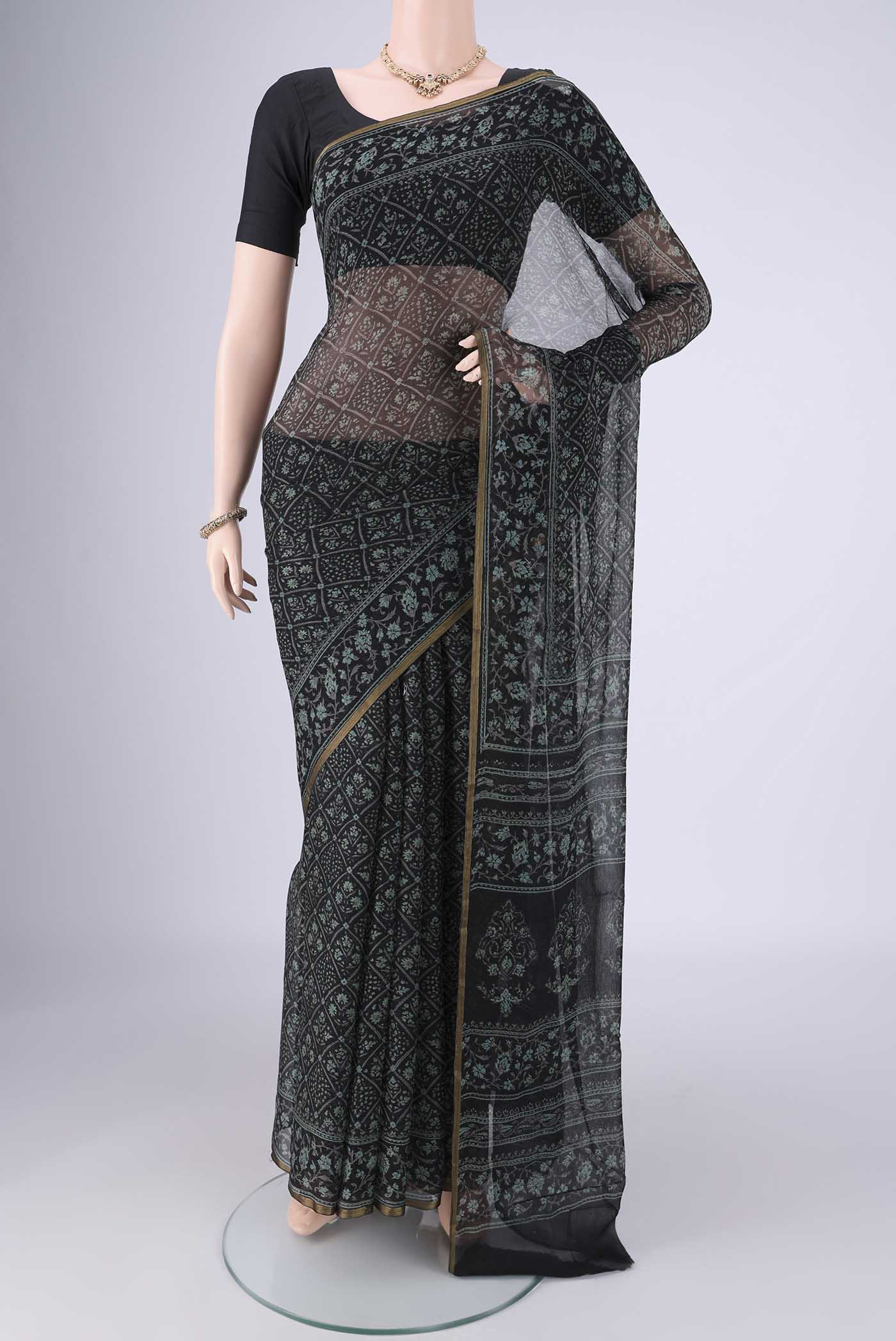 Black Mysore Chiffon Saree with Floral Print on the body and Thin Zari Line.  displayed on a mannequin