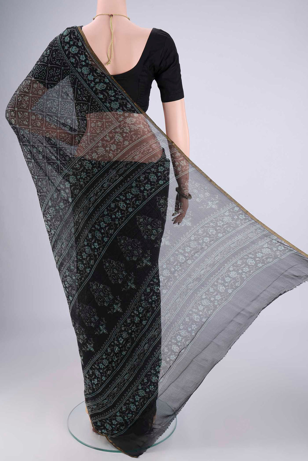 Flat view of Black Mysore Chiffon Saree with Floral Print on the body and Thin Zari Line. 