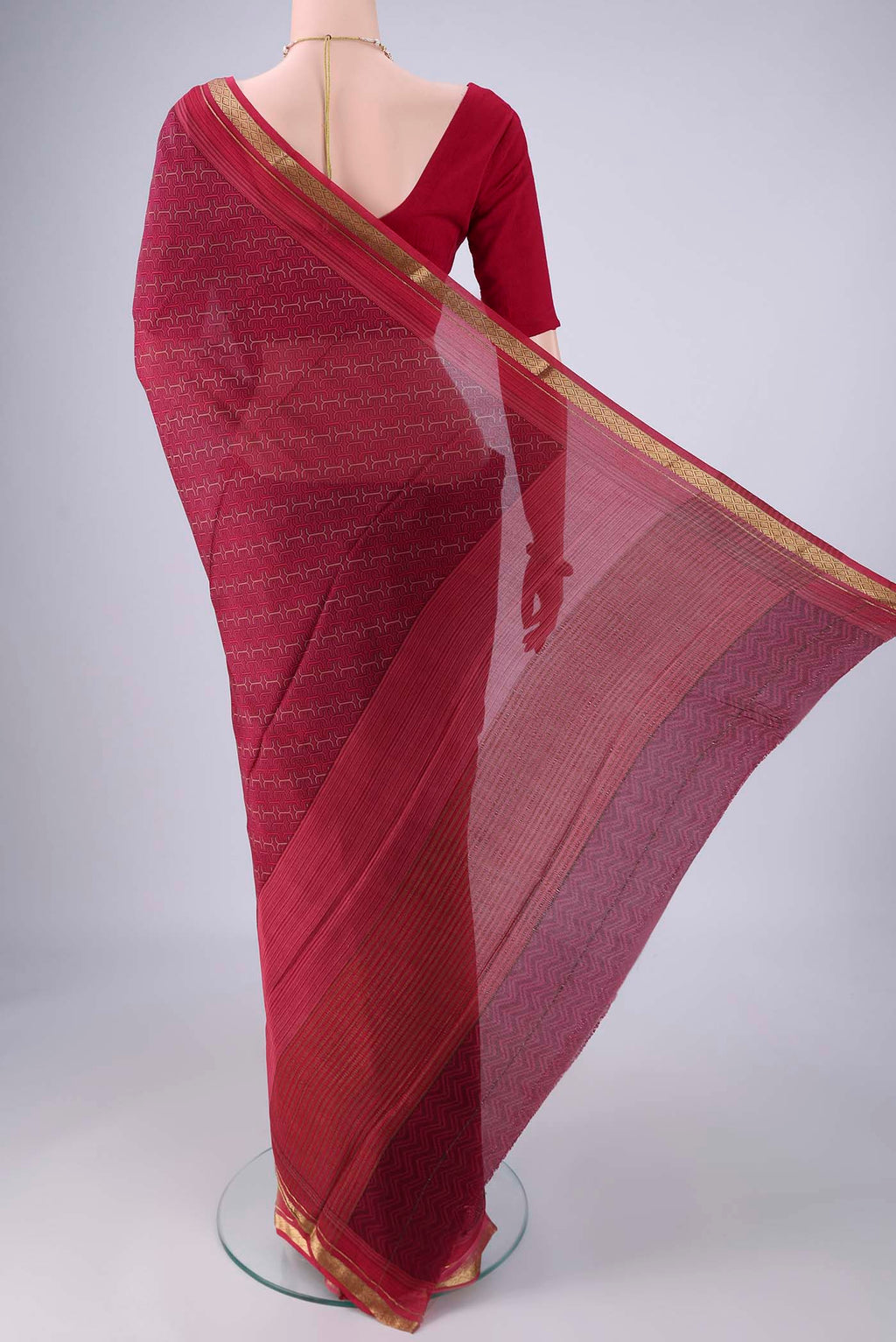 Flat view of Magenta Mysore Crepe Saree with Printed design on the body and Zari Border. 