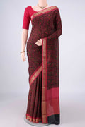 Black Mysore Crepe Saree with Printed design on the body and Zari Border.  displayed on a mannequin