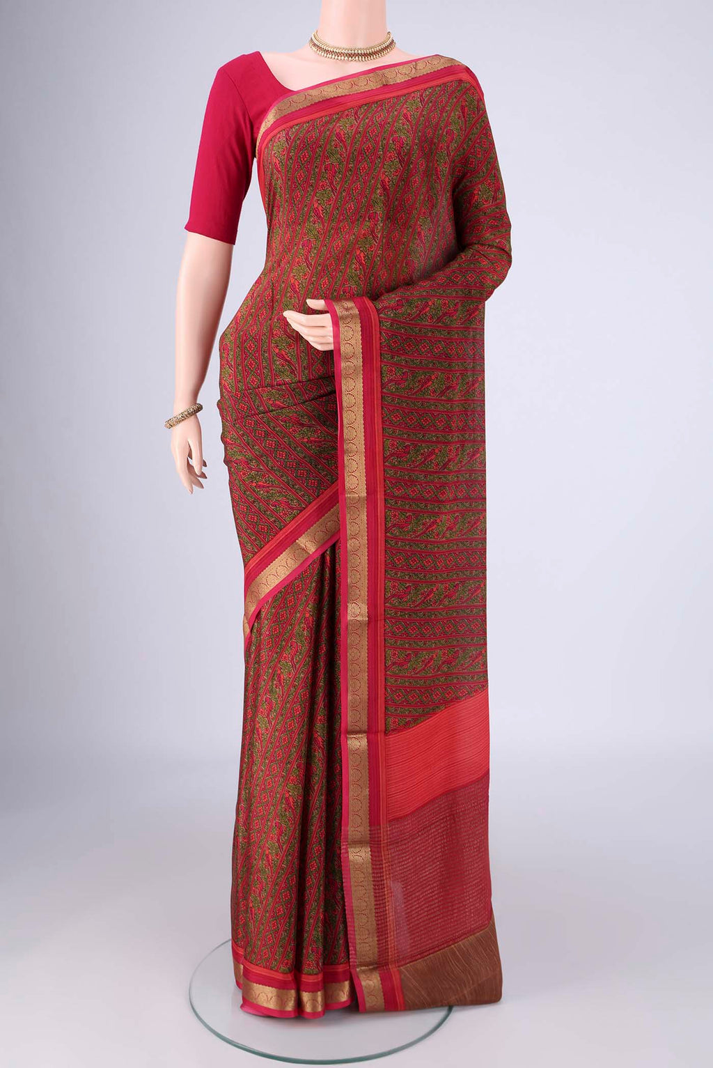 Pink Mysore Crepe Saree with Printed design on the body and Zari Border.  displayed on a mannequin