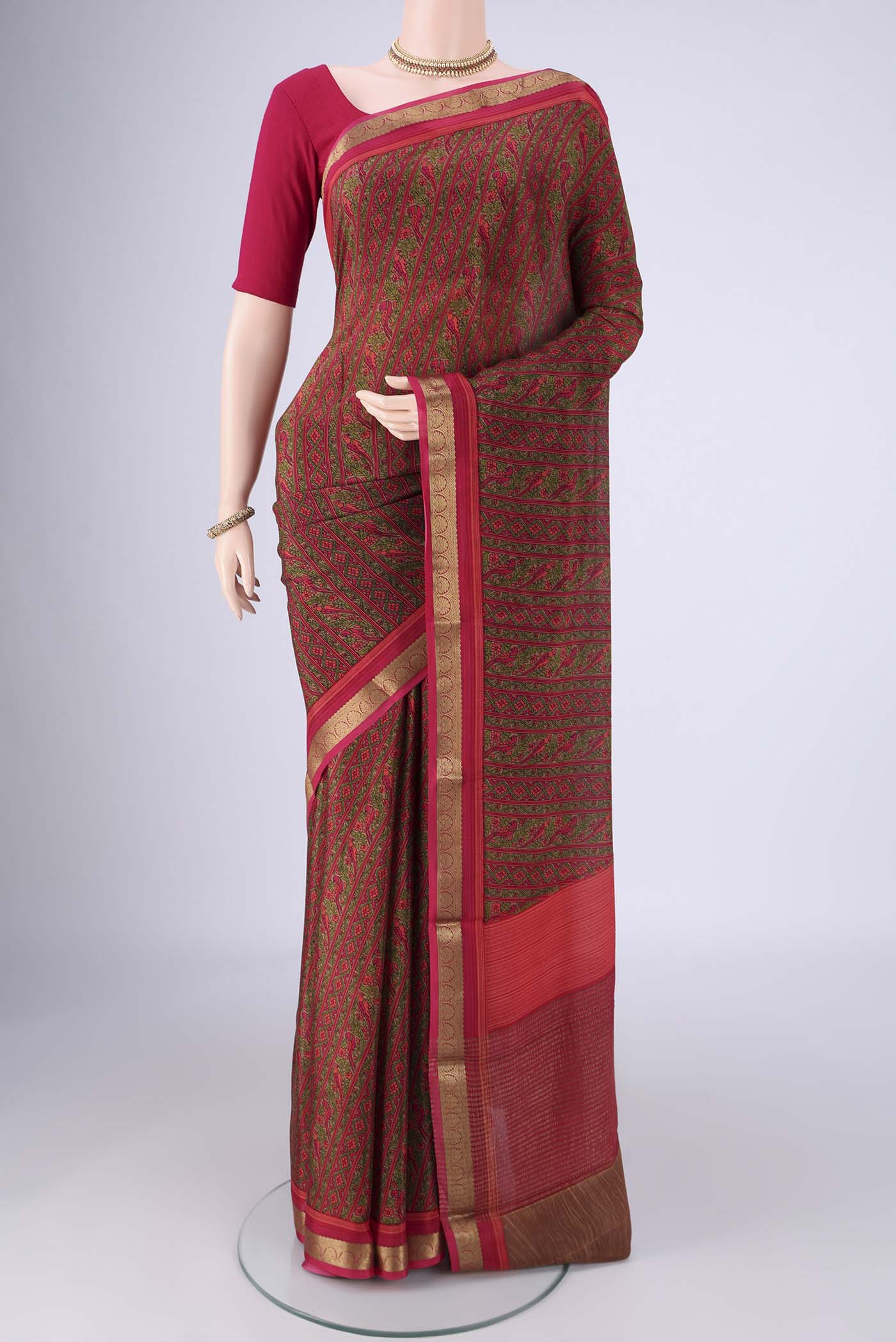 Pink Mysore Crepe Saree with Printed design on the body and Zari Border.  displayed on a mannequin