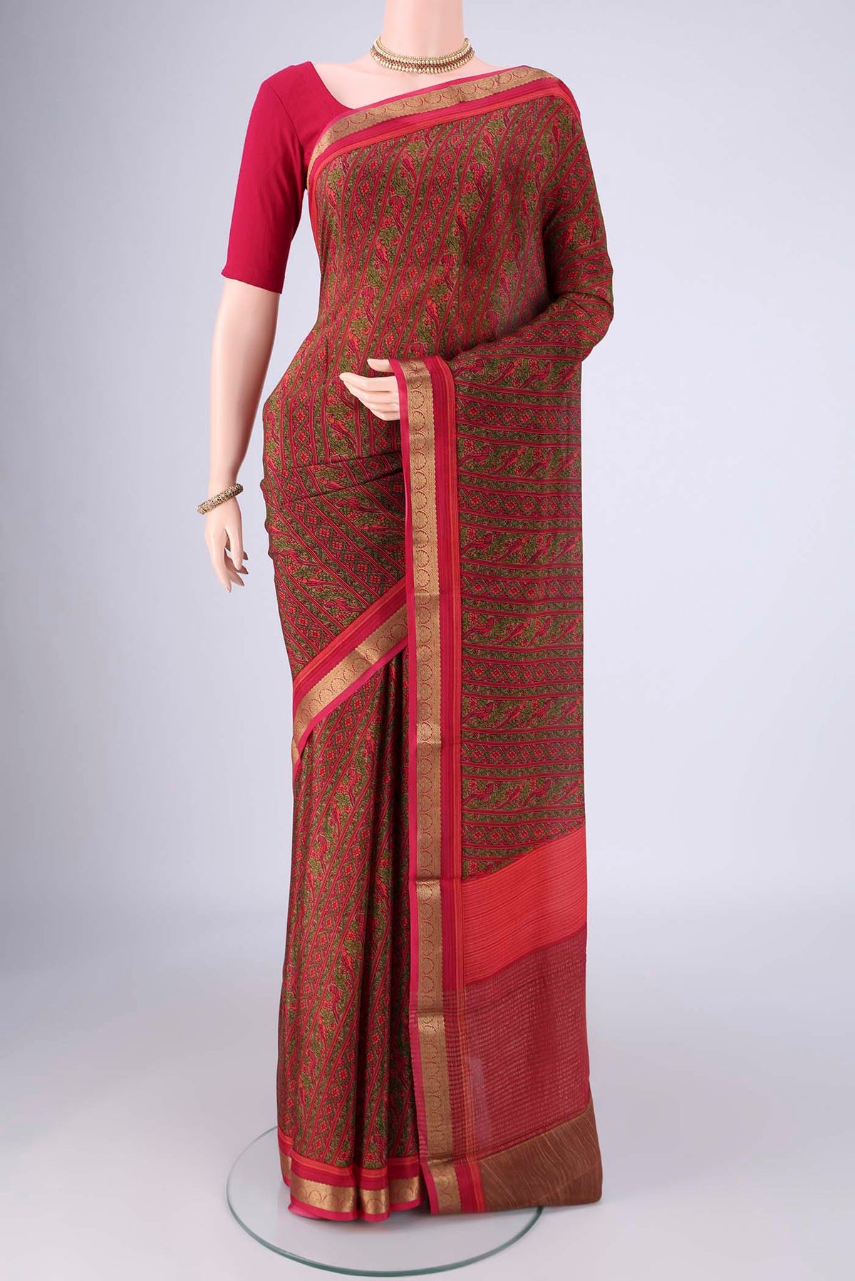 Pink Mysore Crepe Saree with Printed design on the body and Zari Border.  displayed on a mannequin