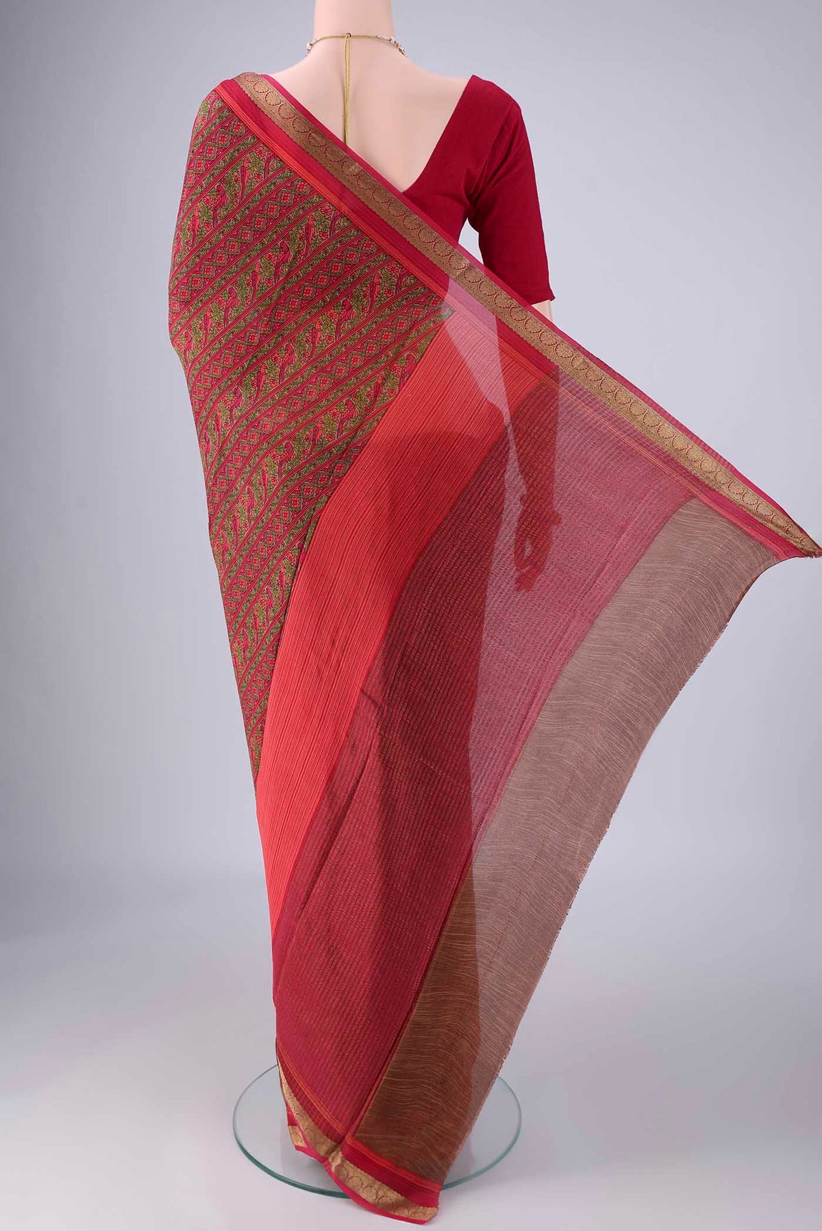 Flat view of Pink Mysore Crepe Saree with Printed design on the body and Zari Border. 