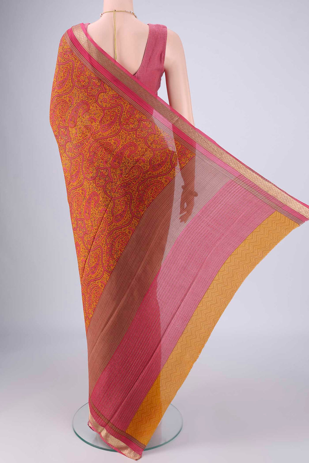 Flat view of Mustard Mysore Crepe Saree with Printed design on the body and Zari Border. 