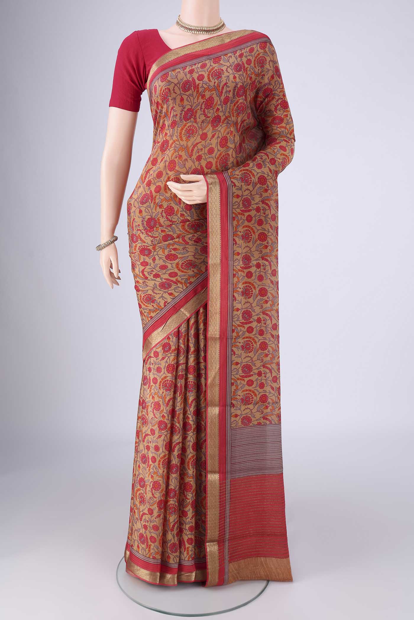 Brown Mysore Crepe Saree with Printed design on the body and Zari Border.  displayed on a mannequin