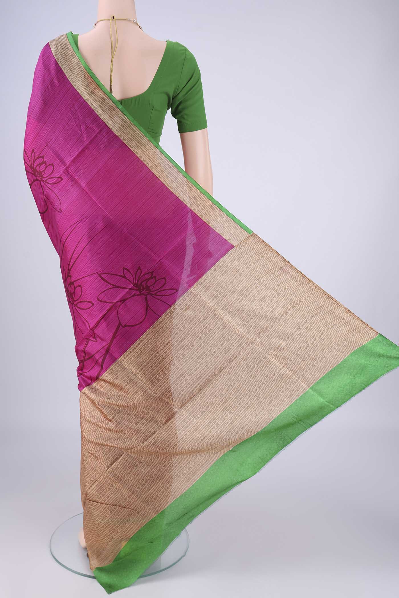 Flat view of Rani Pink Printed Silk Saree with Printed design on the body and Printed Border. 