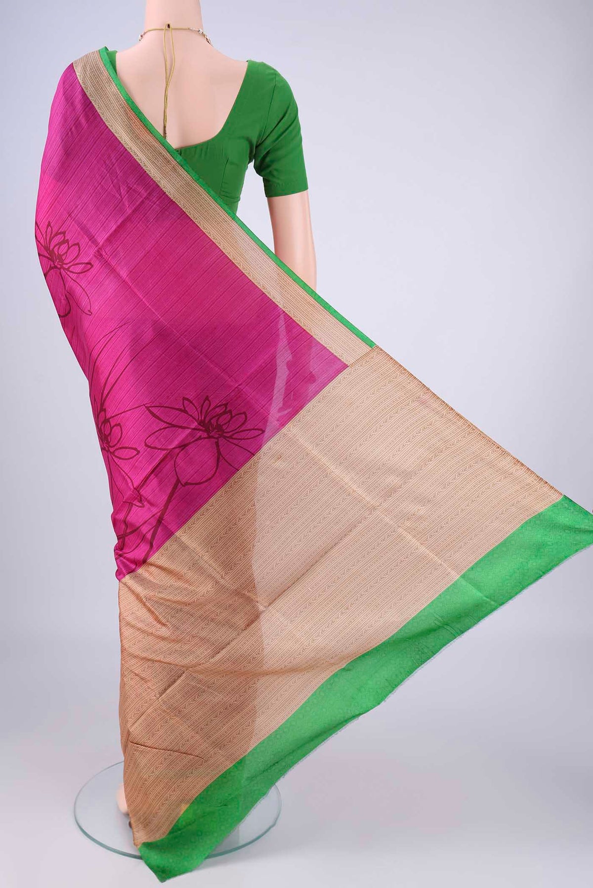Flat view of Rani Pink Printed Silk Saree with Printed design on the body and Printed Border. 