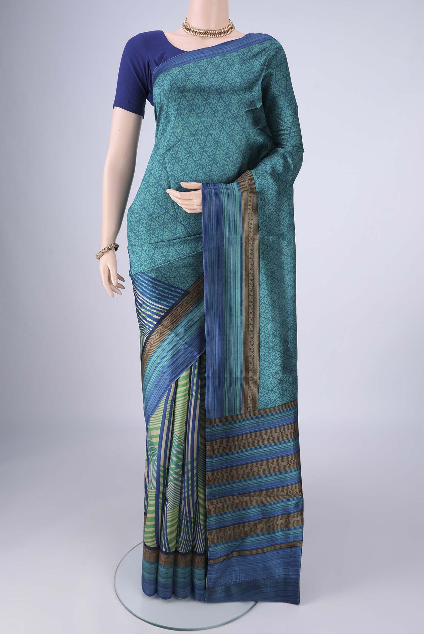 Multi Color Printed Silk Saree with Half And Half on the body and Printed Border.  displayed on a mannequin