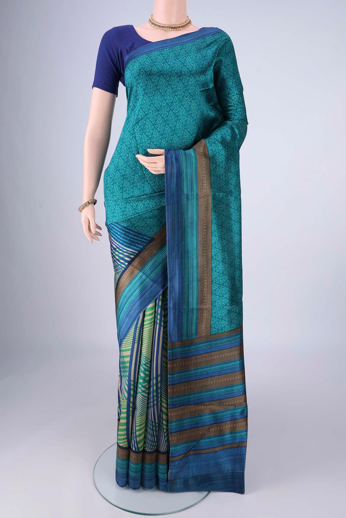 Multi Color Printed Silk Saree with Half And Half on the body and Printed Border.  displayed on a mannequin