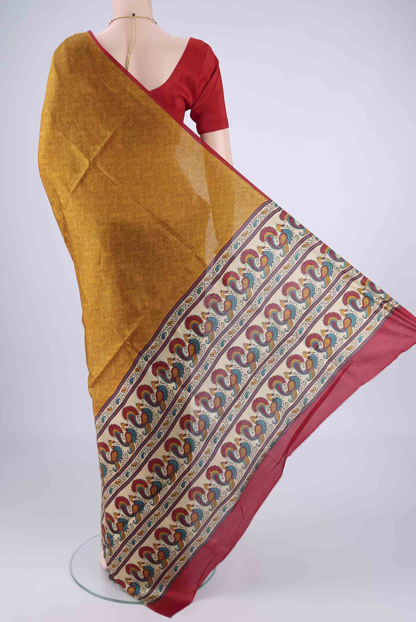 Flat view of Mustard Printed Silk Saree with Printed design on the body and Plain Border. 