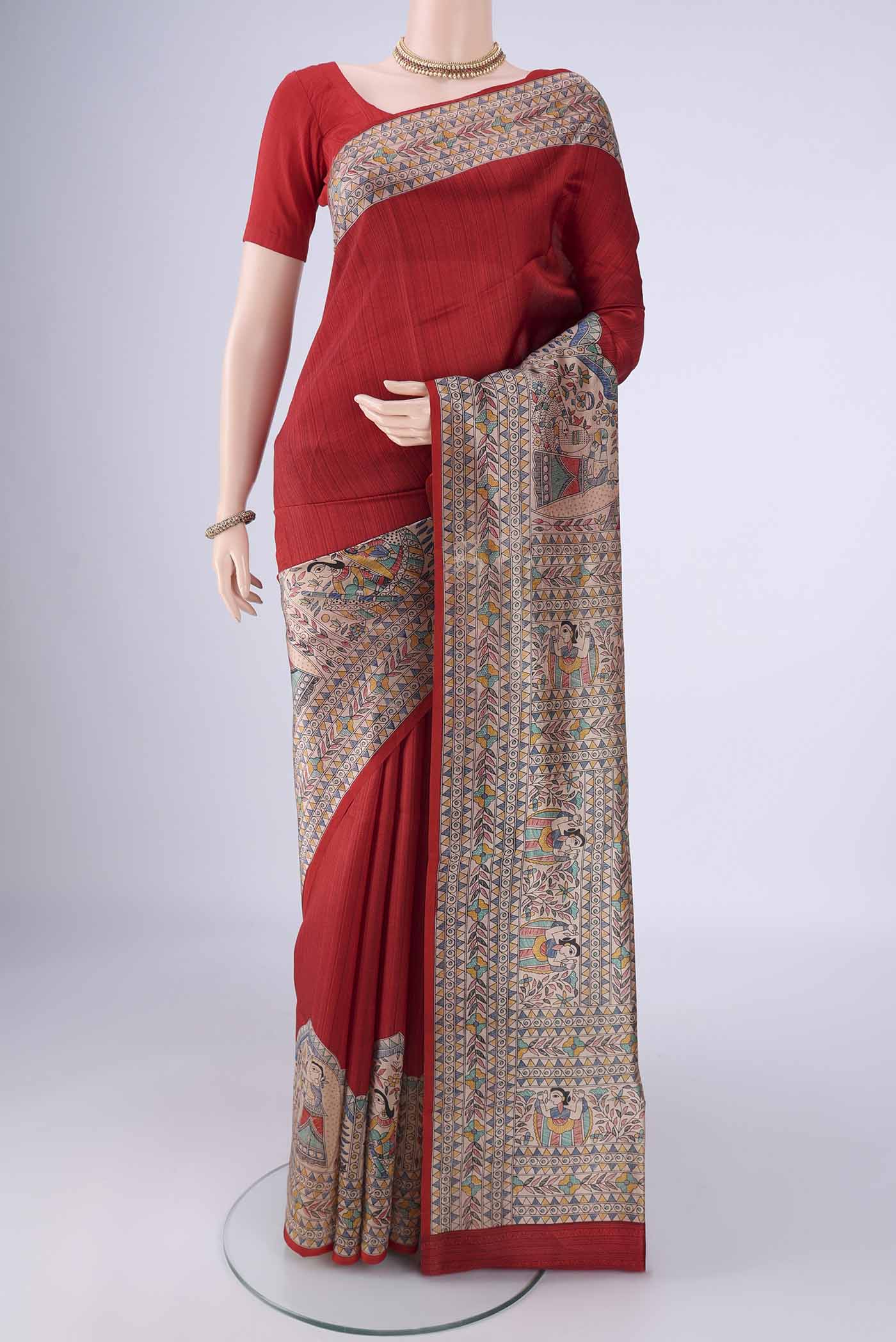 Red Printed Silk Saree with Printed design on the body and Printed Border.  displayed on a mannequin