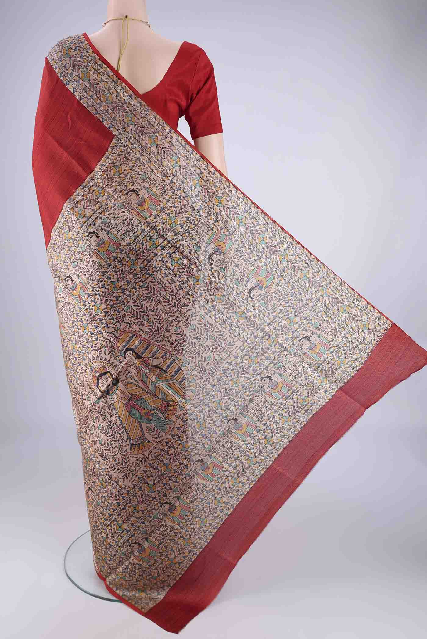 Flat view of Red Printed Silk Saree with Printed design on the body and Printed Border. 