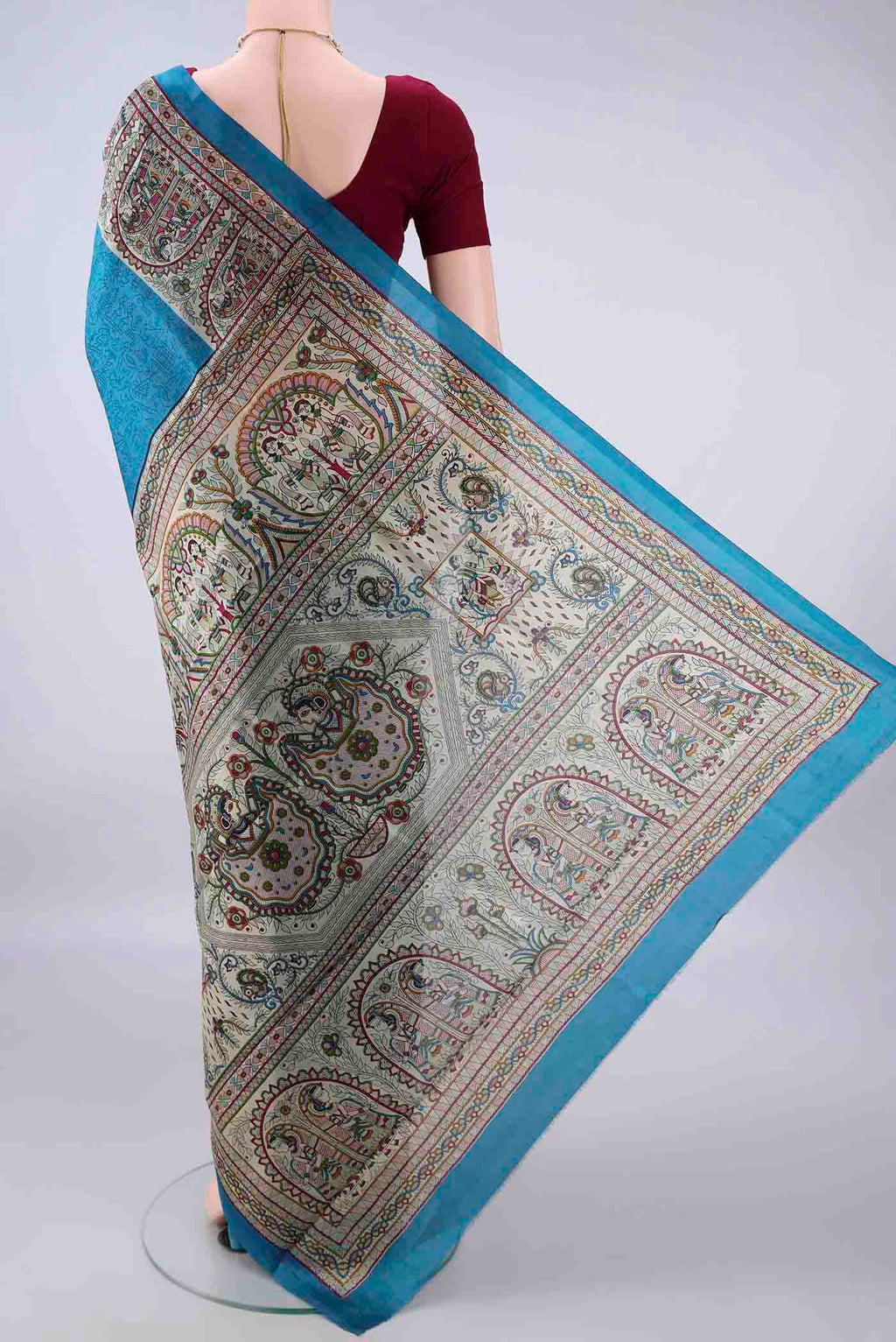 Flat view of Pure Silk Blue Printed Saree with Printed design on the body and Printed Border. 